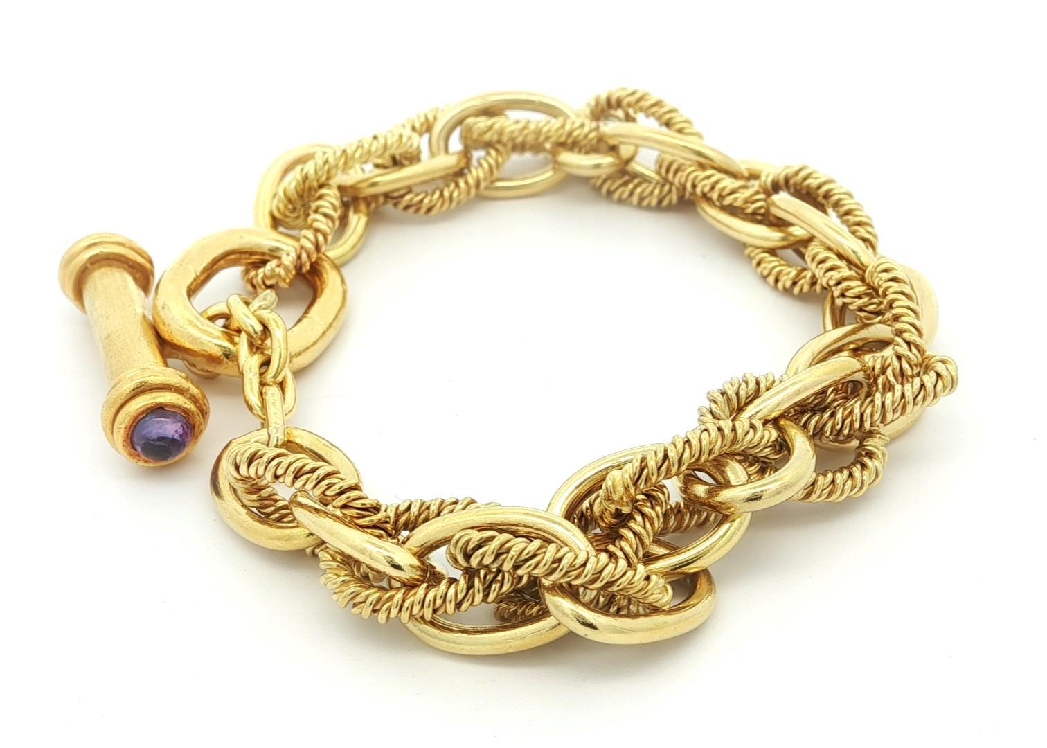 --Stone(s):--
(2) Natural Genuine Purple Sapphire - Round Cabochon Cut - Bezel Set - Pastel Purple Color - 3.9mm each (approx.) 

Material: Solid 18k Yellow Gold Link Chain with 20k Yellow Gold Clasp
Weight: 51.1 Grams
Chain Type: Interlocking Plain