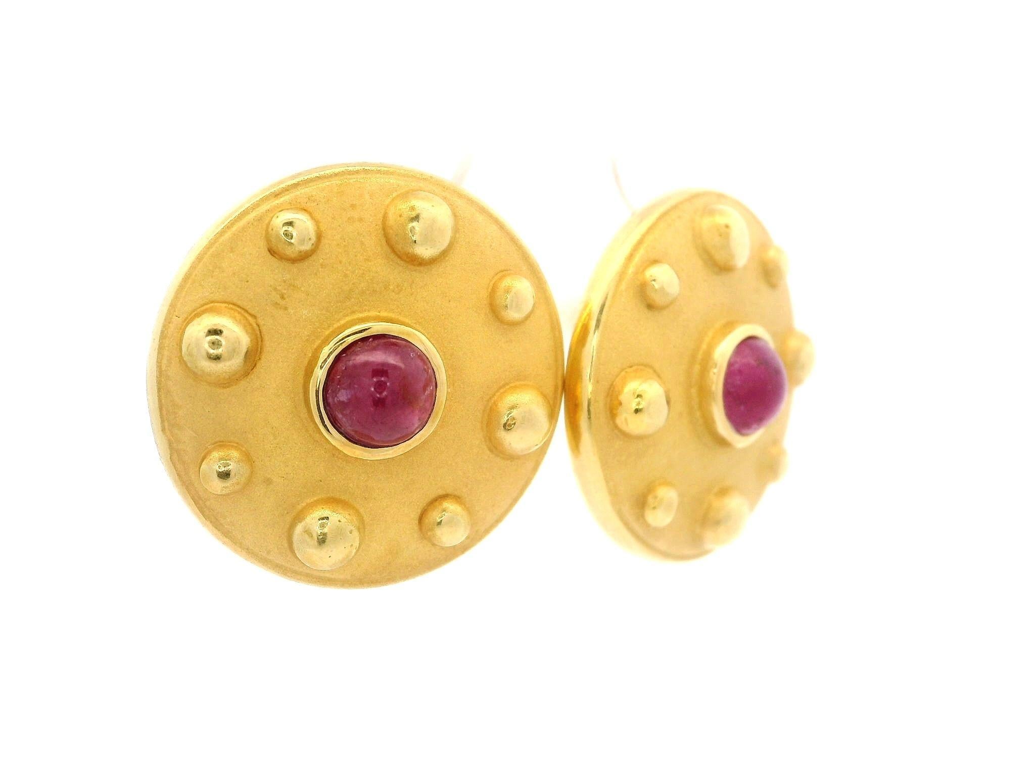 --Stone(s):--
(2) Natural Genuine Ruby - Round Cabochon Cut - Bezel Set - Deep Red Color - Natural Inclusions - 4.7mm each (approx.)

Material: Solid 18k Yellow Gold w/ 14k Backs
Weight: 8.19 Grams
Backing: Posts w/ Butterfly backings (Pierced ears