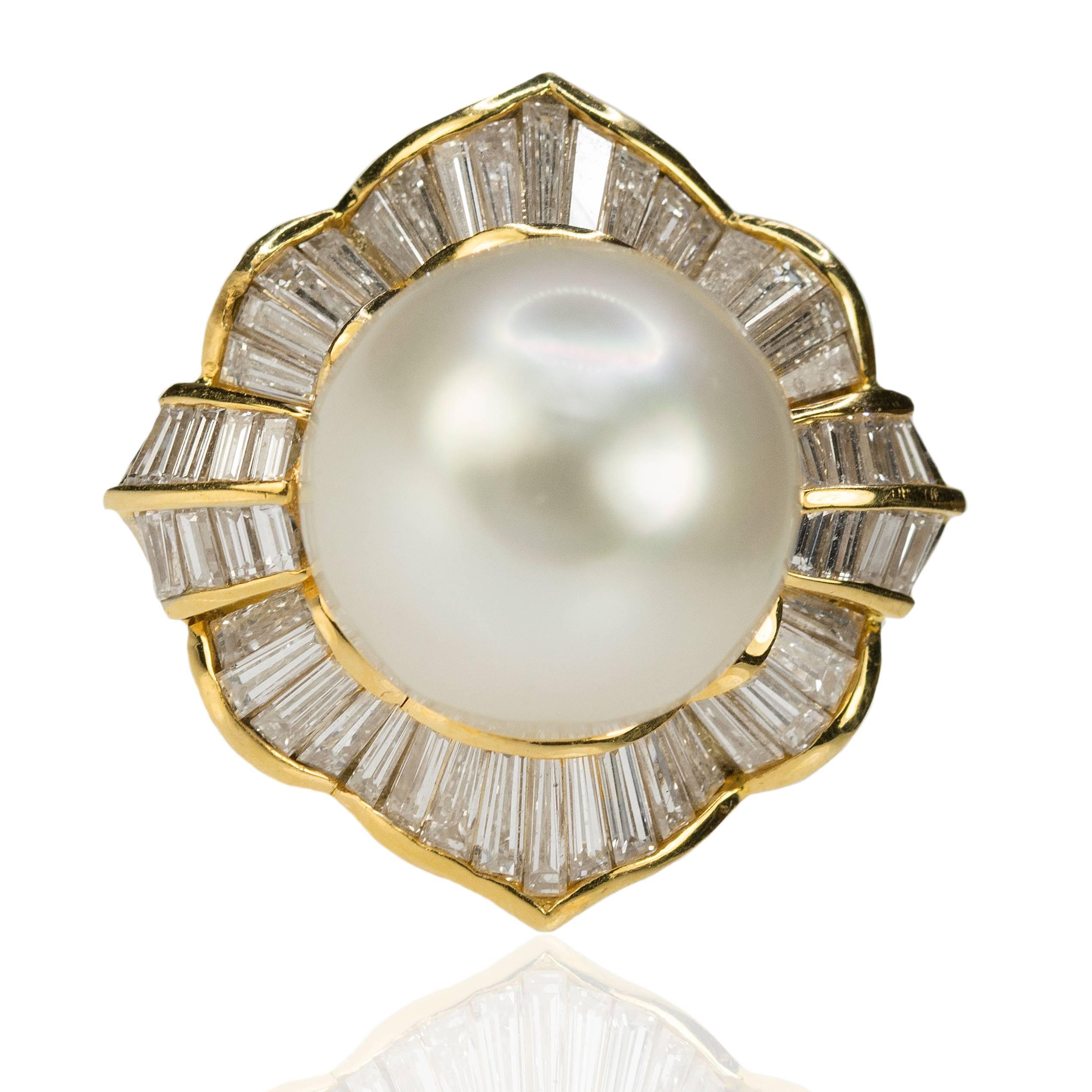 Stunning 13.5mm South Sea Pearl set in 18k yellow gold ring with 46 bagueete diamonds weighing approximately 2.00 carats.