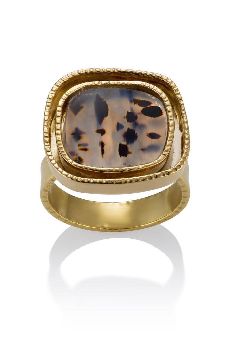 18K Yellow gold and a Spotted Agate stone, which has been hand cut by the artist herself, is a one of a kind ring.  This unique spotted agate stone is bezel set in bright yellow 18K gold on top of a white gold back round in order to maximize the