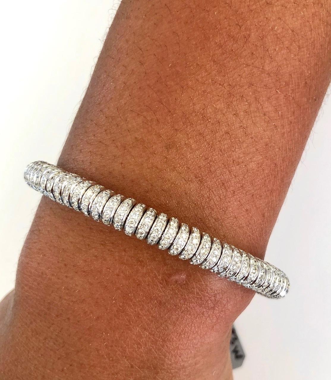 This design of a Bangle Bracelet is the softest and most comfortable on the wrist, made with our proprietary inner Gold Spring, and due to the tubular design, it makes this feel so good to wear. We offer it in 18K White, or Yellow or Pink Gold each