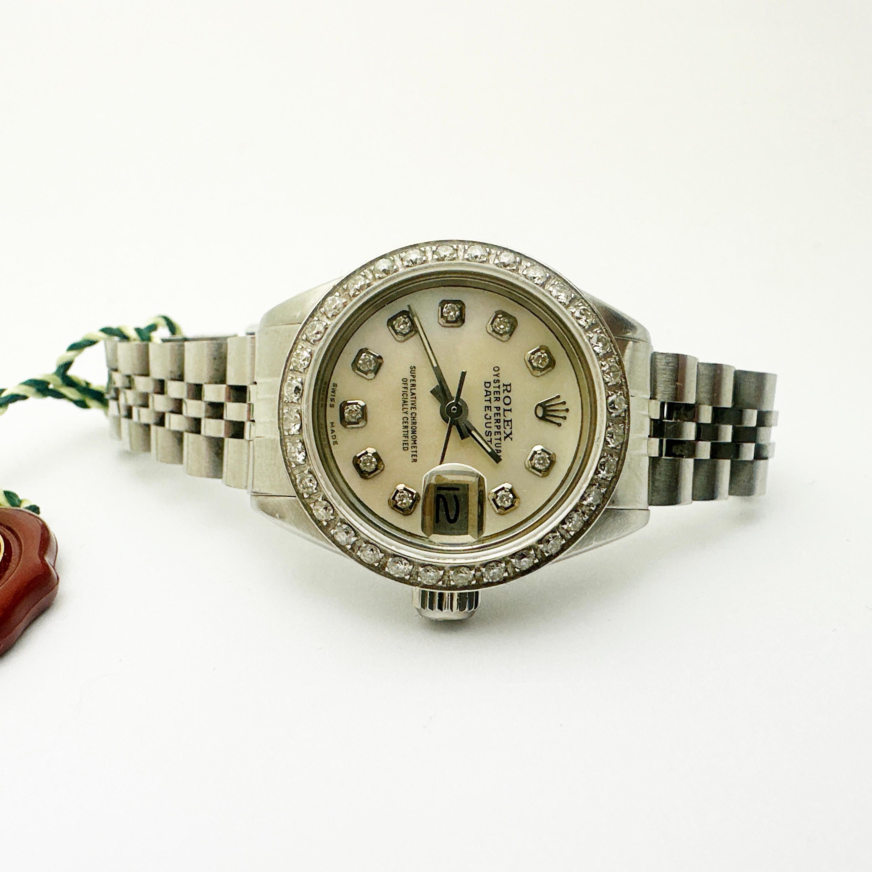 Here is a beautiful 18k and Stainless Steel Ladies ROLEX Oyster Perpetual Datejust w/ 18k diamond bezel and dial

This Rolex features original mechanical movement with automatic winding, Caliber 2030. Size is approx. 26mm (excluding crown).

Model
