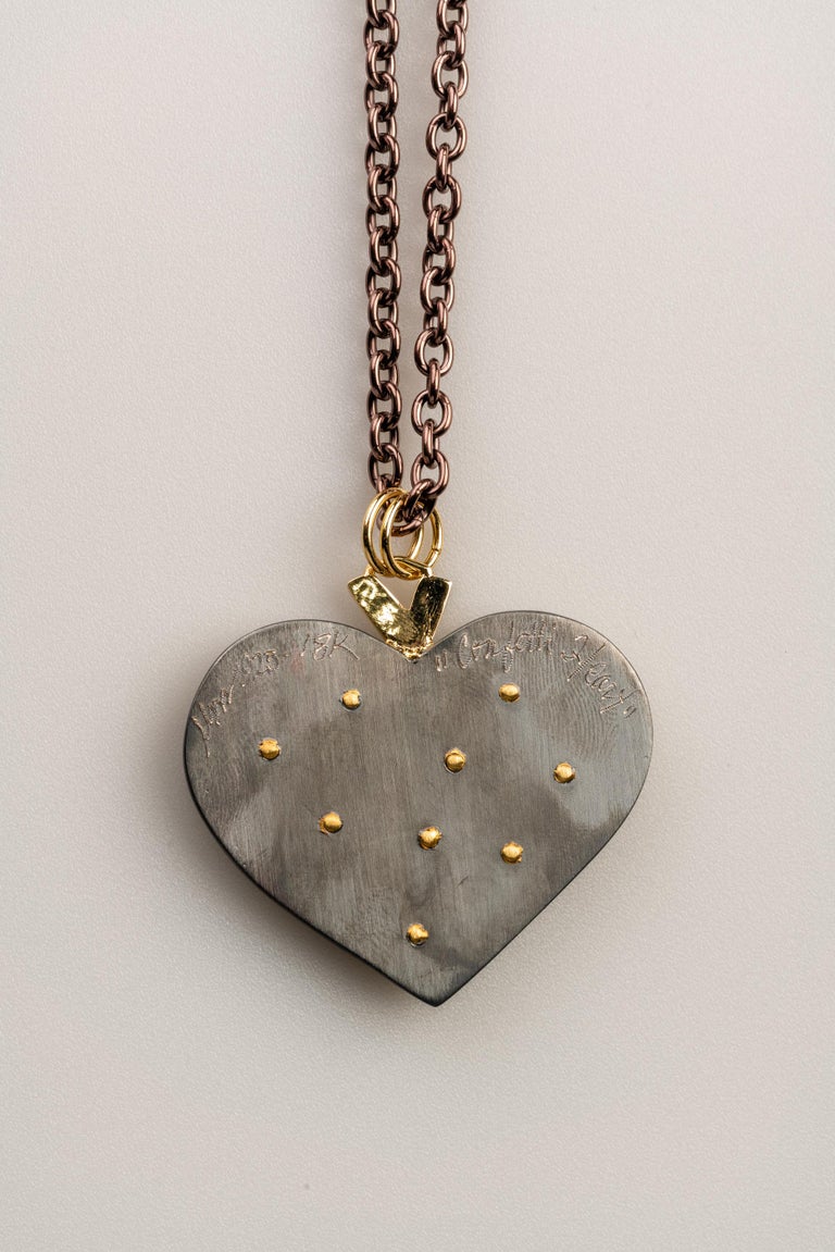 18 Karat, Sterling Silver, and Rusted Iron Heart Necklace with Baguette
