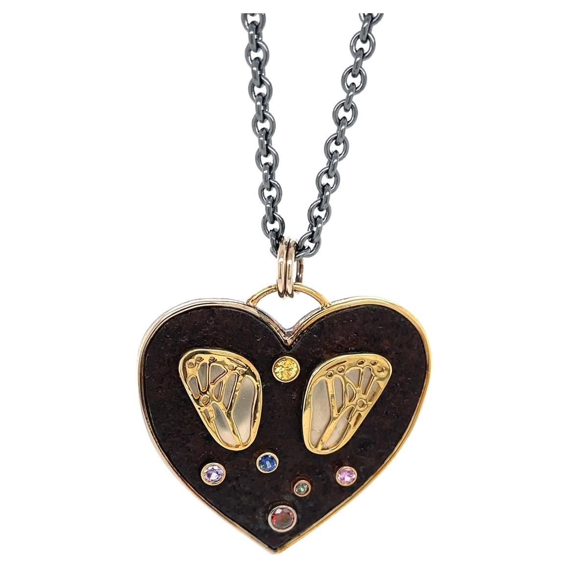 18k & Sterling Silver Wing Heart Pendant with Rusted Iron and Colored Gemstones For Sale