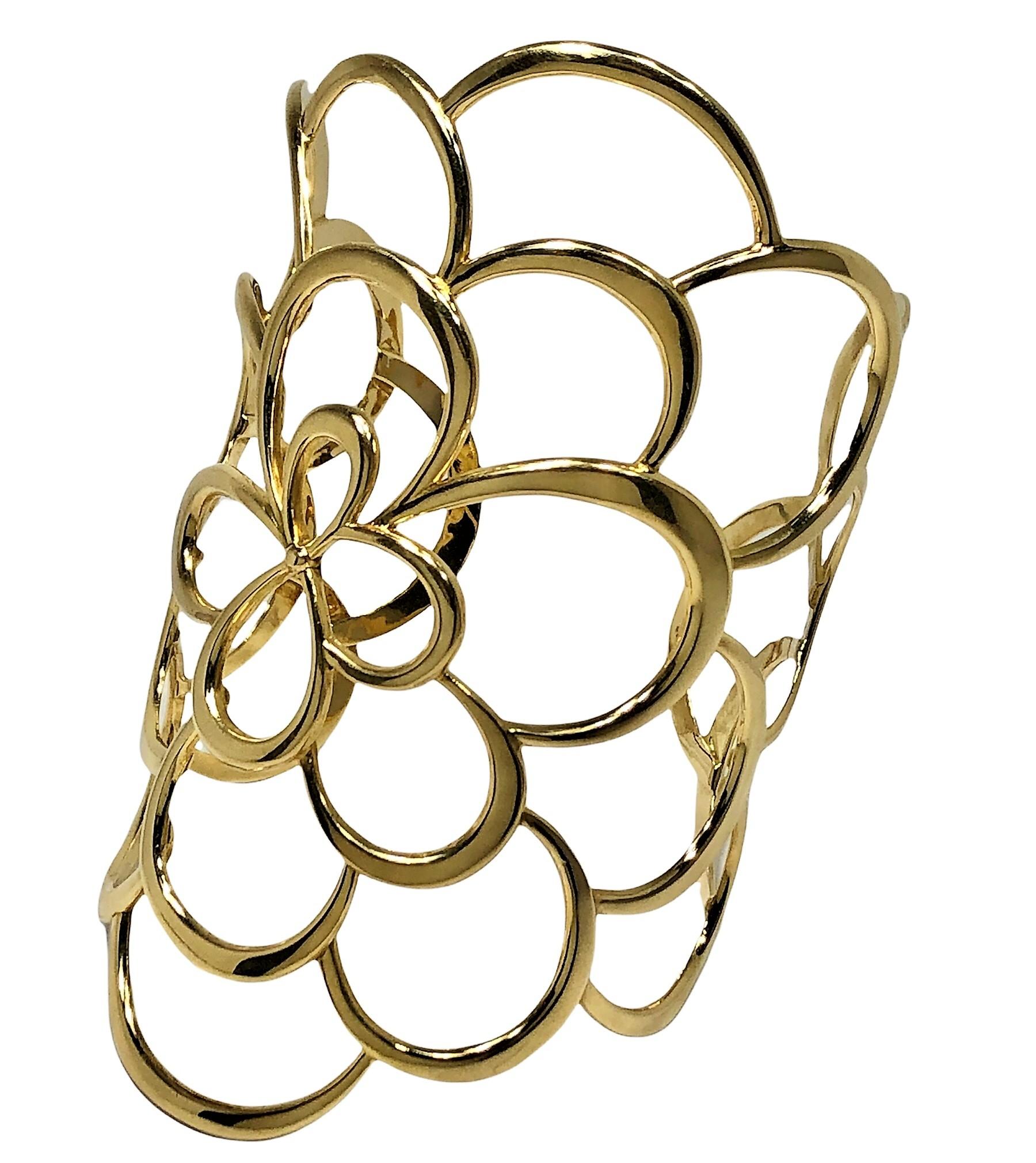 This imaginative and large 18k cuff, signed VIVARA, conveys the impression that it is one enormous Camellia flower. The cuff measures 3 7/8 inches from top to bottom and was crafted for comfortable wear on a small / medium to medium wrist. Open in
