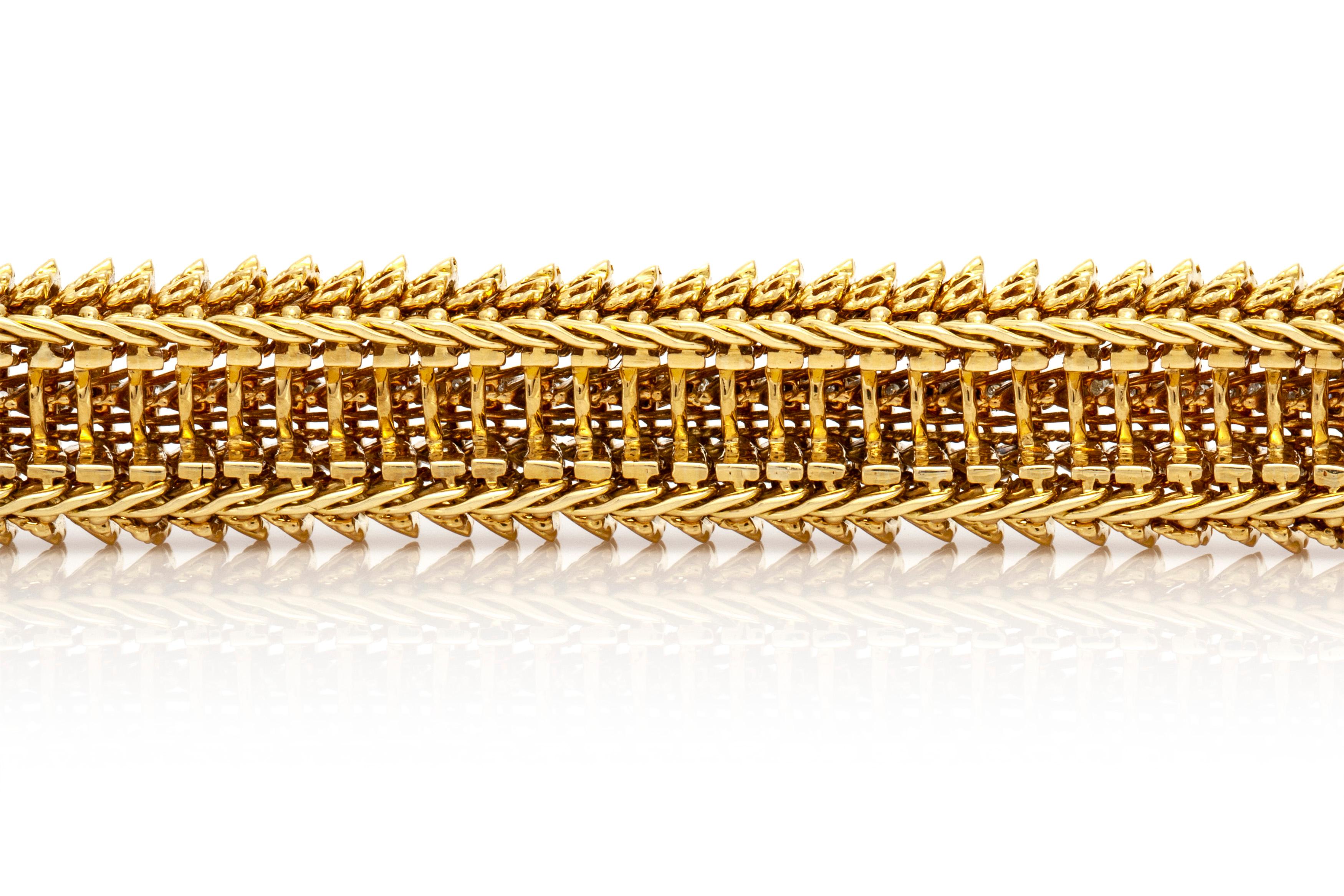 The bracelet is finely crafted in 18k yellow gold with beautiful texture and diamonds weighing approximately total of 5.00 carat.