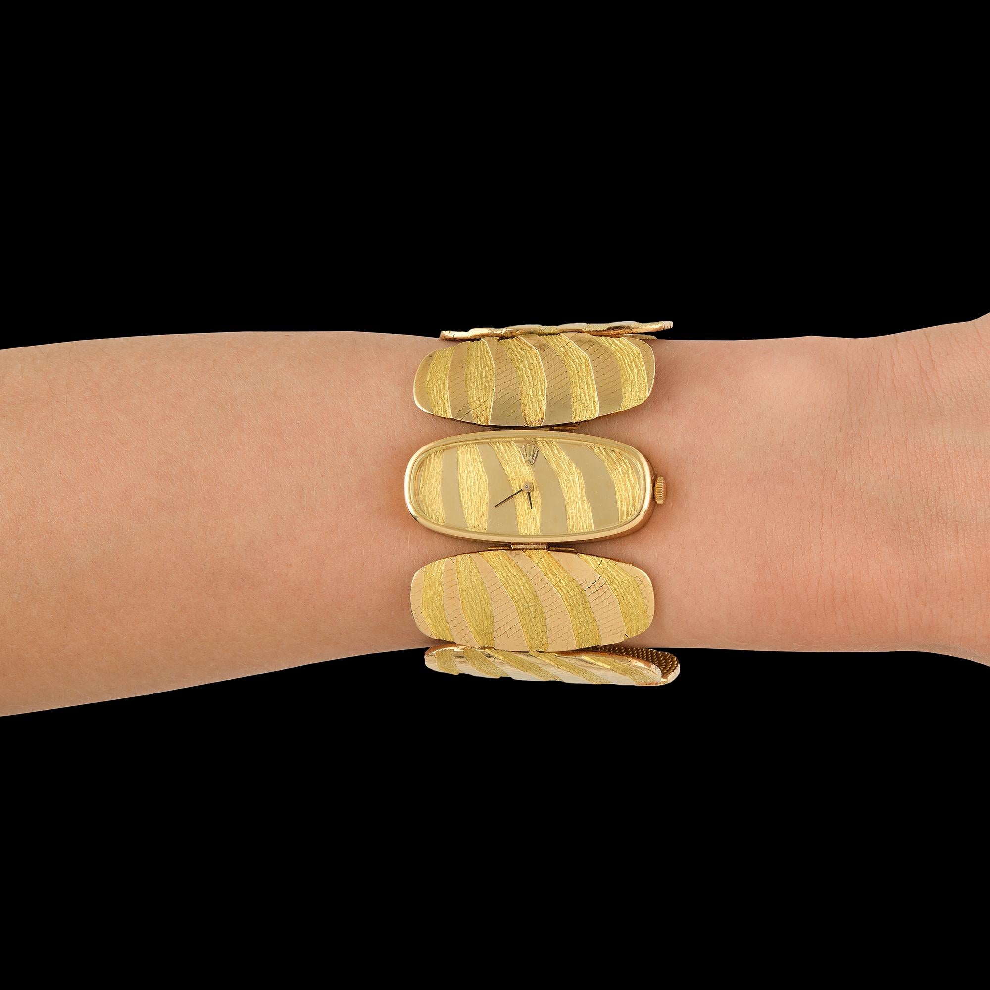 18k Textured Gold Optical Bracelet Watch by George Lenfant
Rare Piece
Circa 1970s
Mechanical Movement
Dimension: 4×17.5 cm
Weight: approx 130 gr