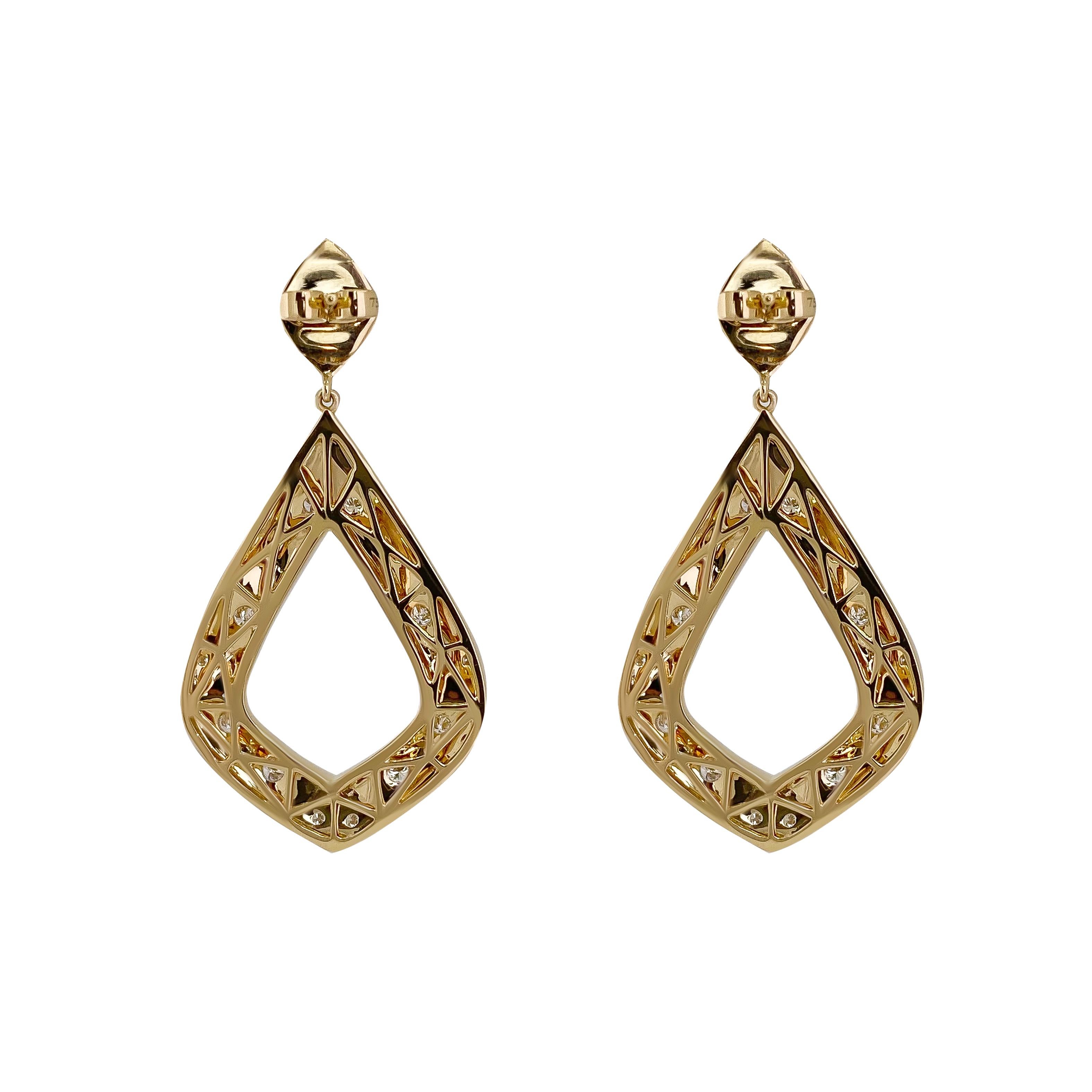 These earrings are part of the ORIGAMI collection. They were inspired by geometric aesthetics giving the earrings texture and dimension. The earrings are made with solid 18k yellow gold and a high polished shine. 30pcs of sprinkled F color diamonds