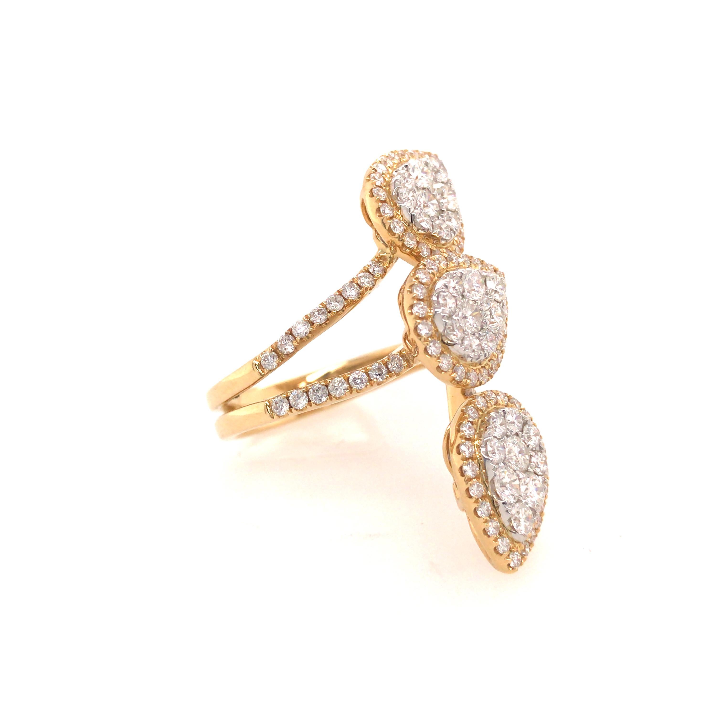 Three Pear Shape Cluster Ring in 18K Two-Tone Gold.  Round Brilliant Cut Diamonds weighing 2.03 carat total weight, G-H in color and VS-SI in clarity are expertly set.  The ring measures 1.5 inch in length and 1/2 inch in width at the widest point. 