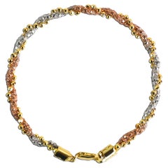 Bracelet à maillons en spirale en or tricolore 18K 9g