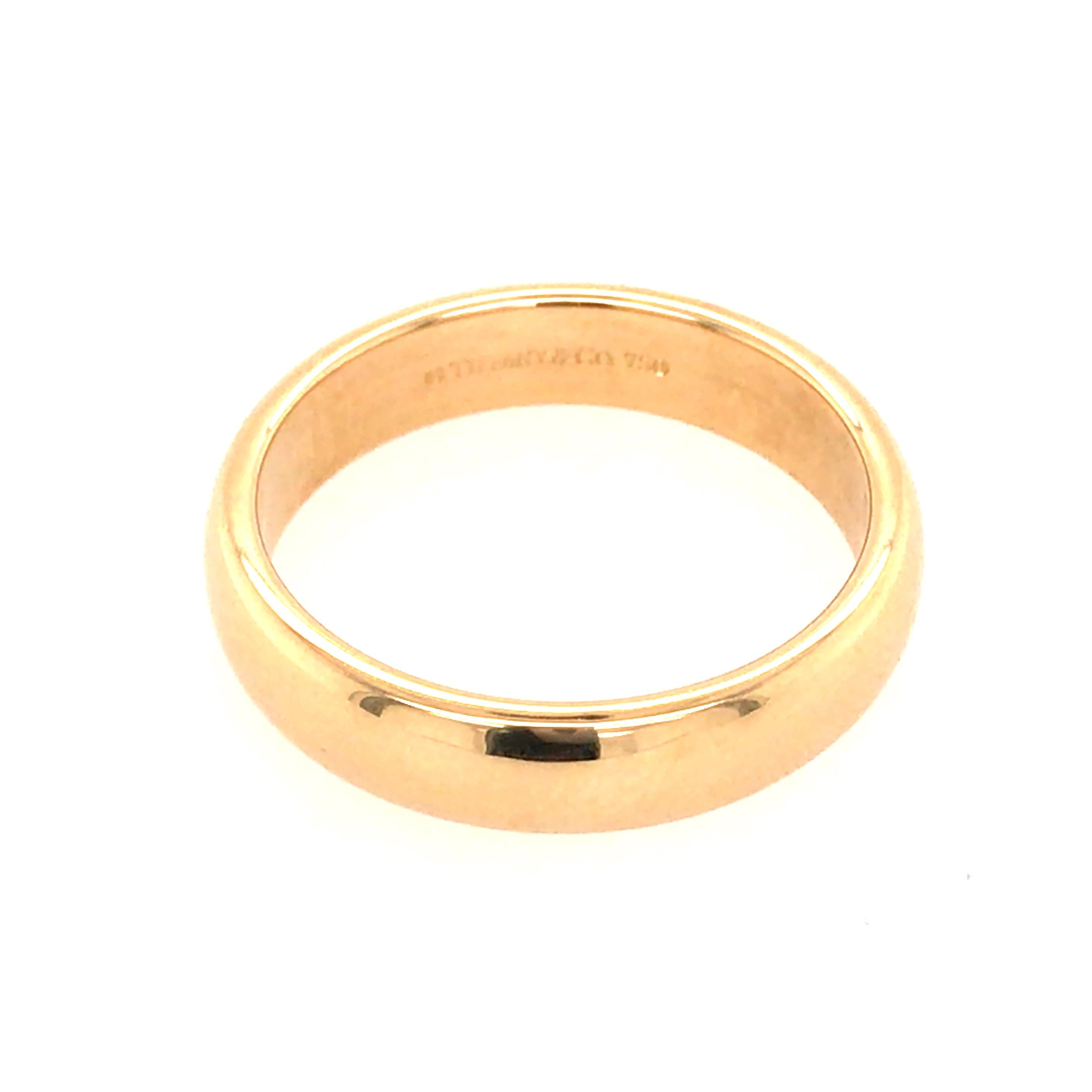 Tiffany & Co.  Wedding Band in 18K Yellow Gold.  The Band measures 3/16 in width and weighs 5.75 grams.  Ring size 7 1/4.  Stamped 