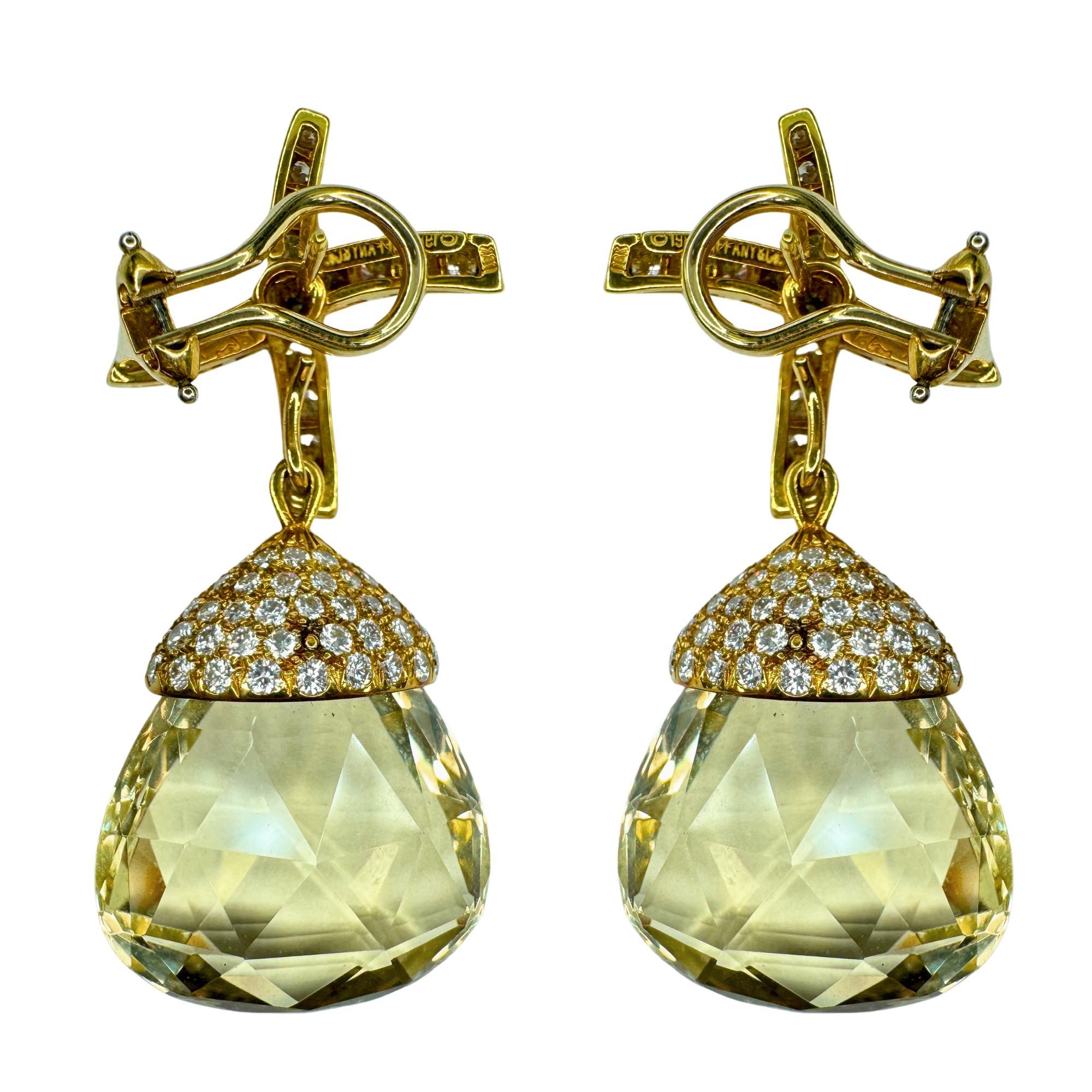 Add timeless elegance and sophistication to your look with these stunning 18k 1980's Tiffany & Co. Day-Night earrings, designed and signed by Paloma Picasso. The dazzling combination of diamonds and lemon citrine stones is sure to turn heads, while
