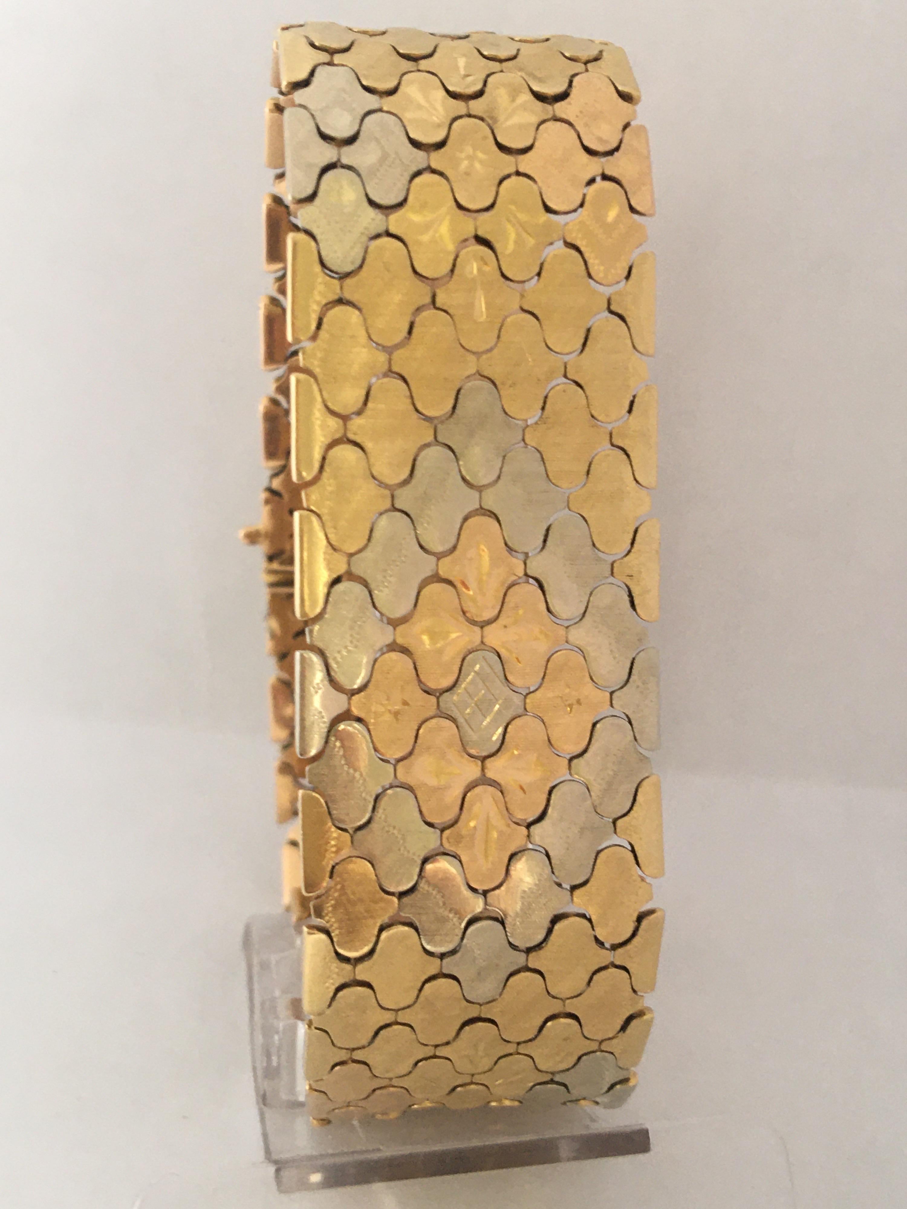 This beautiful pre-owned Ladies Gold Bracelet has aged and wear with some tiny and light scratches on the gold metal leaf as shown. It is measured 8.5 inches Long and 0.9 inch depth and weighed 60.9 grams.

Please study the images carefully as form