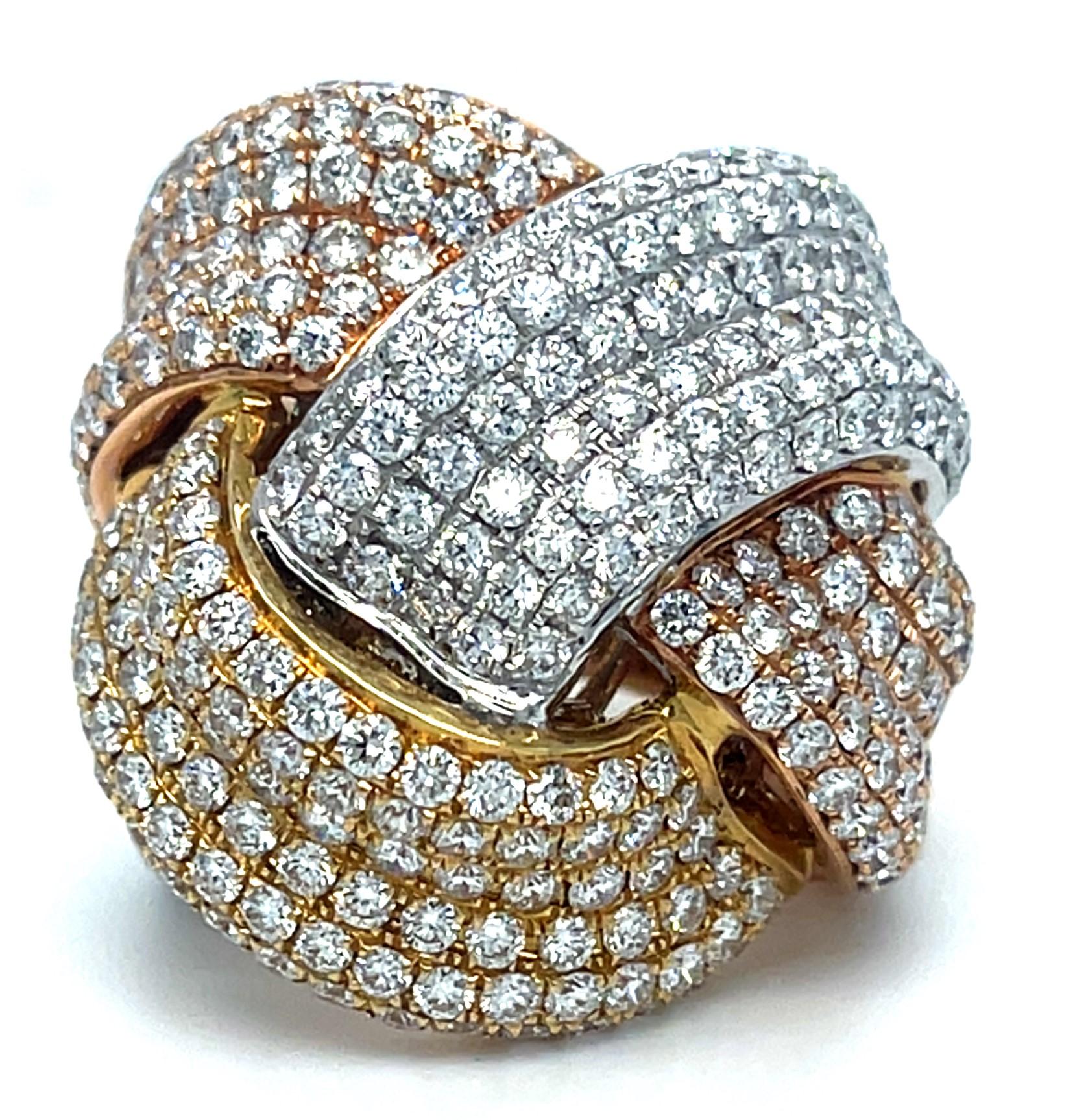 Gorgeous Three-Gold Knot Ring by Afarin
Features 6.40 carats of diamonds in braid-knot design
Width of Plaque = Appx 22 mm Wide
Width of Band at Reverse = 8 mm
Size 6.25
Total Mass = 22.5 grams
Featured in Bonham's California Jewels Auction December