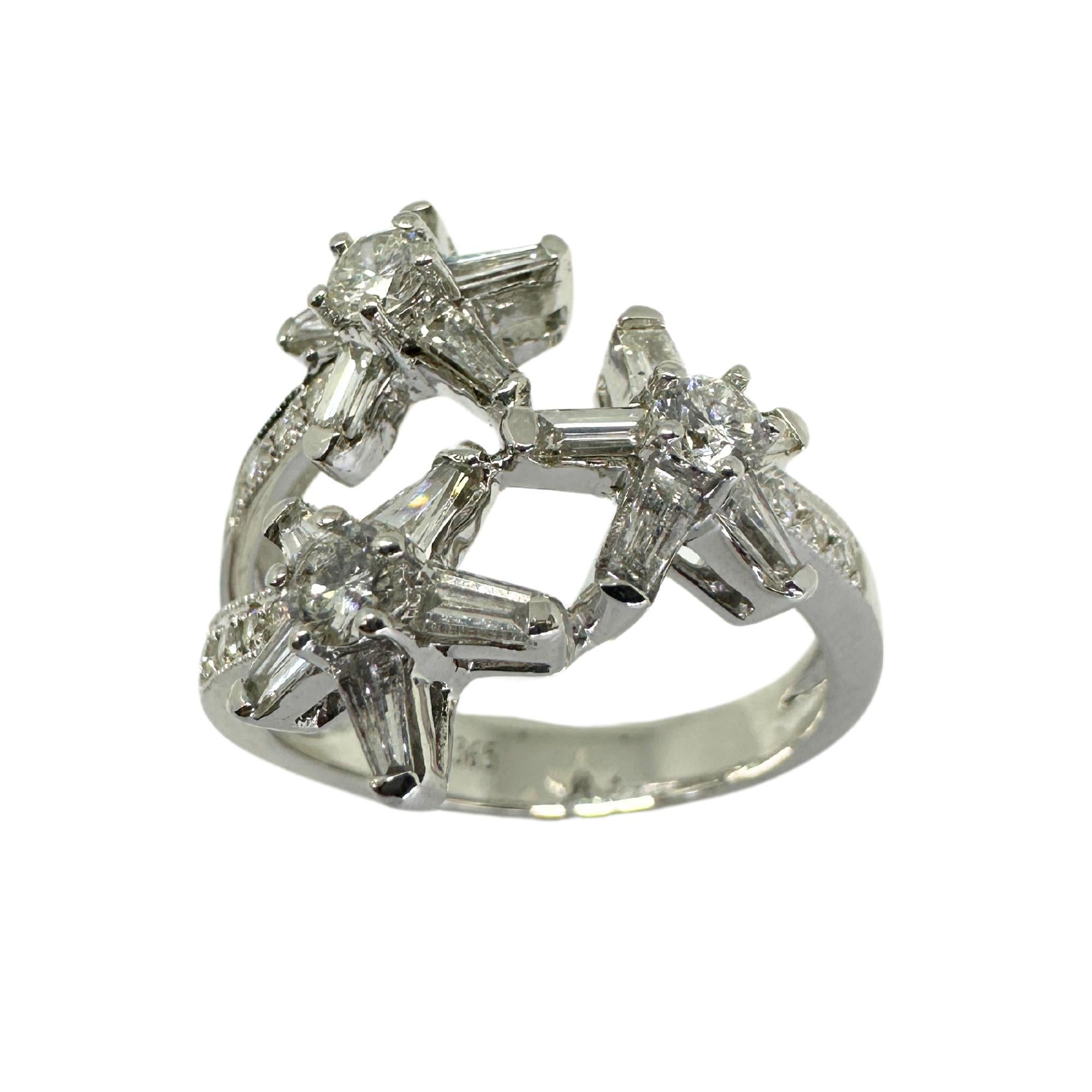 Add some sparkle to your wardrobe with this 18k white gold ring featuring a stunning trillion cut diamonds and diamond accents weighing a total of 1.04 carats. The unique star design and delicate markings make this ring a cute and charming addition
