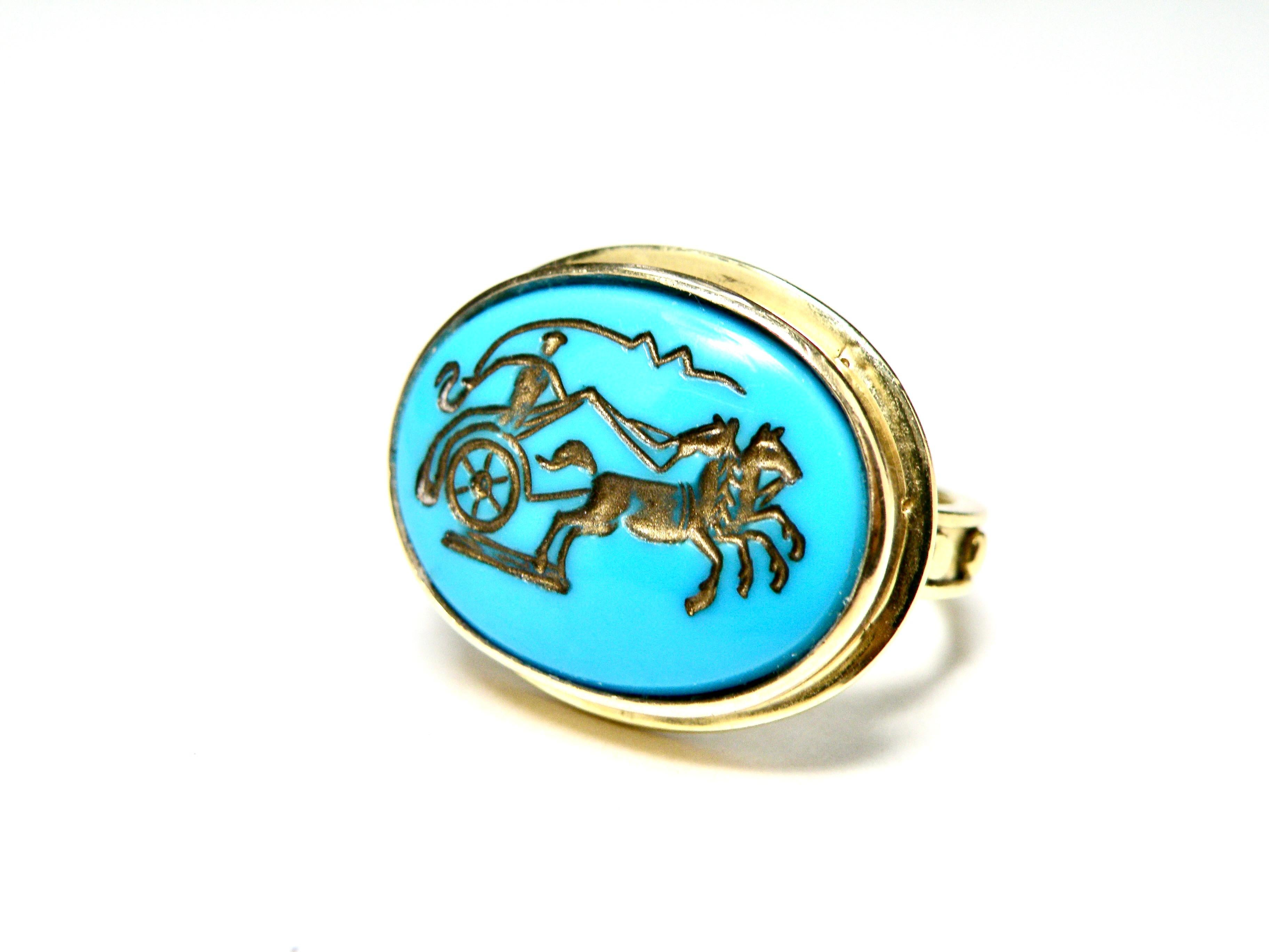 Turquoise oval Intaglio ring. A charioteer with horses