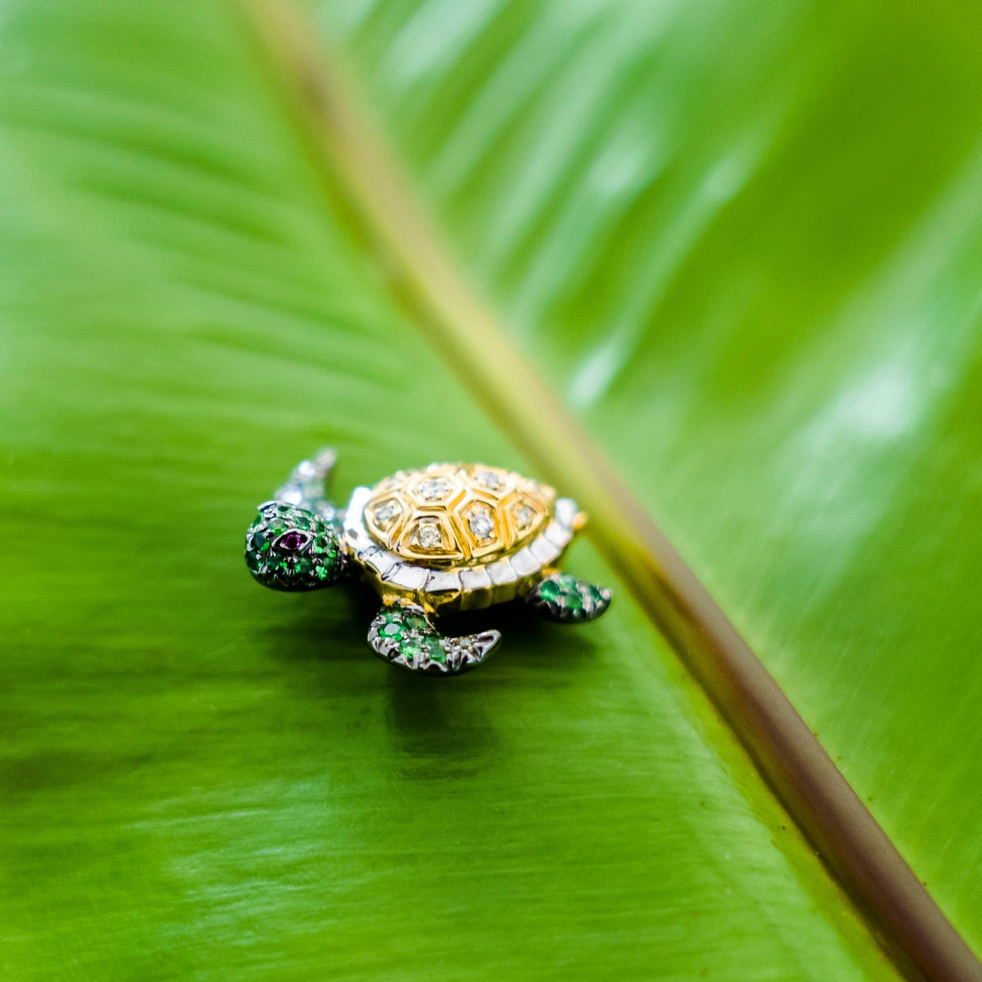 18K Turtle Mixed Diamond and Green Garnet Brooch

10 Mixed Colored Diamonds - 0.08 CT
42 Green Garnets - 0.35 CT
2 Rubies - 0.01 CT
2 Yellow Sapphires - 0.02 CT
18K Gold - 3.95 GM

Turtle represents intuitive development, protection, wisdom,