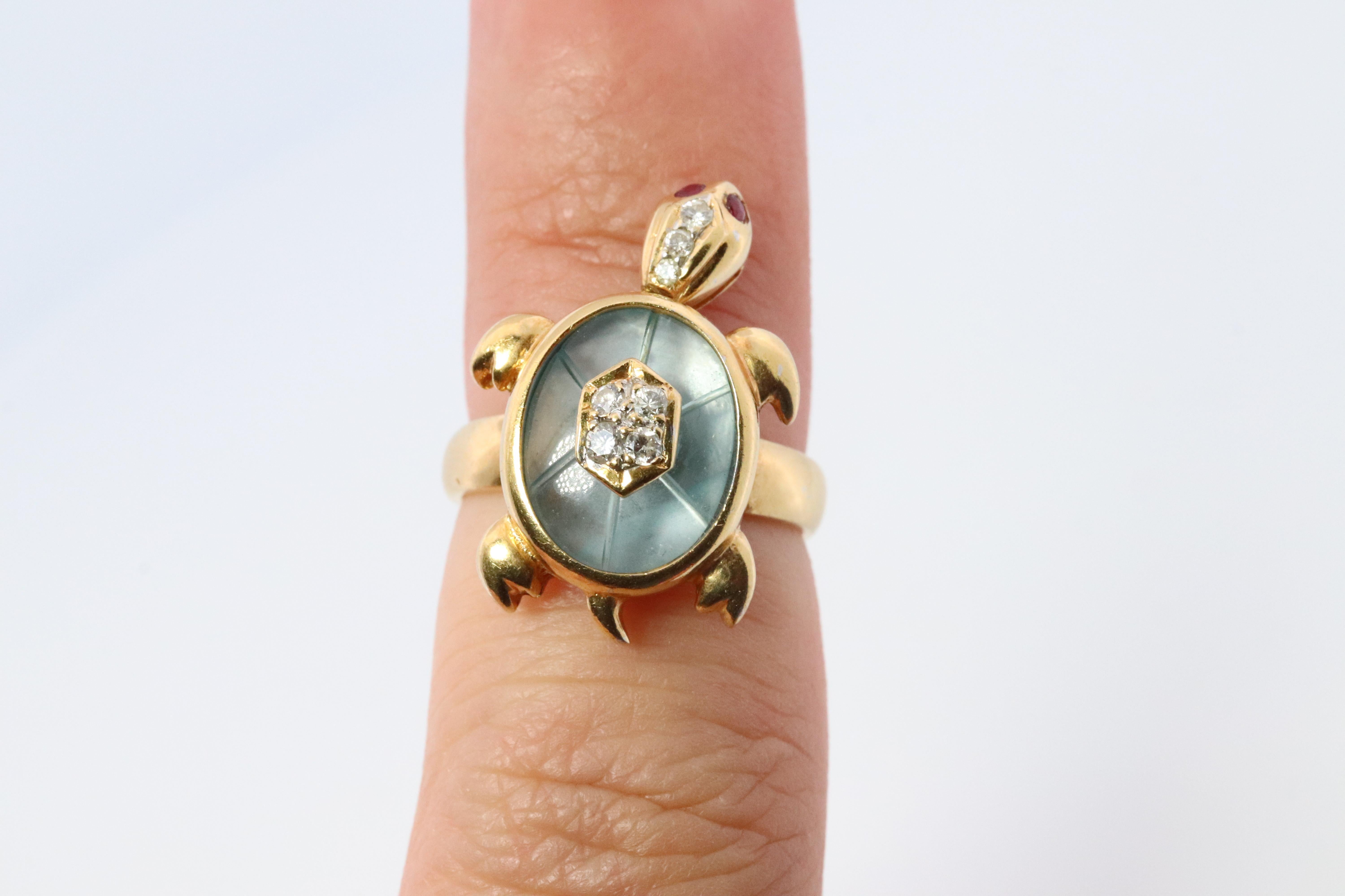 Adorable and Cute Turtle Ring.

3D made with Animated Head

18k Yellow gold with Carved Topaz shell, encrusted diamonds, and ruby eyes.

Light Blue Topaz 10mm by 14mm oval

Extremely rare.

Details:
Size 5.75 ( can be reasonably resized, please