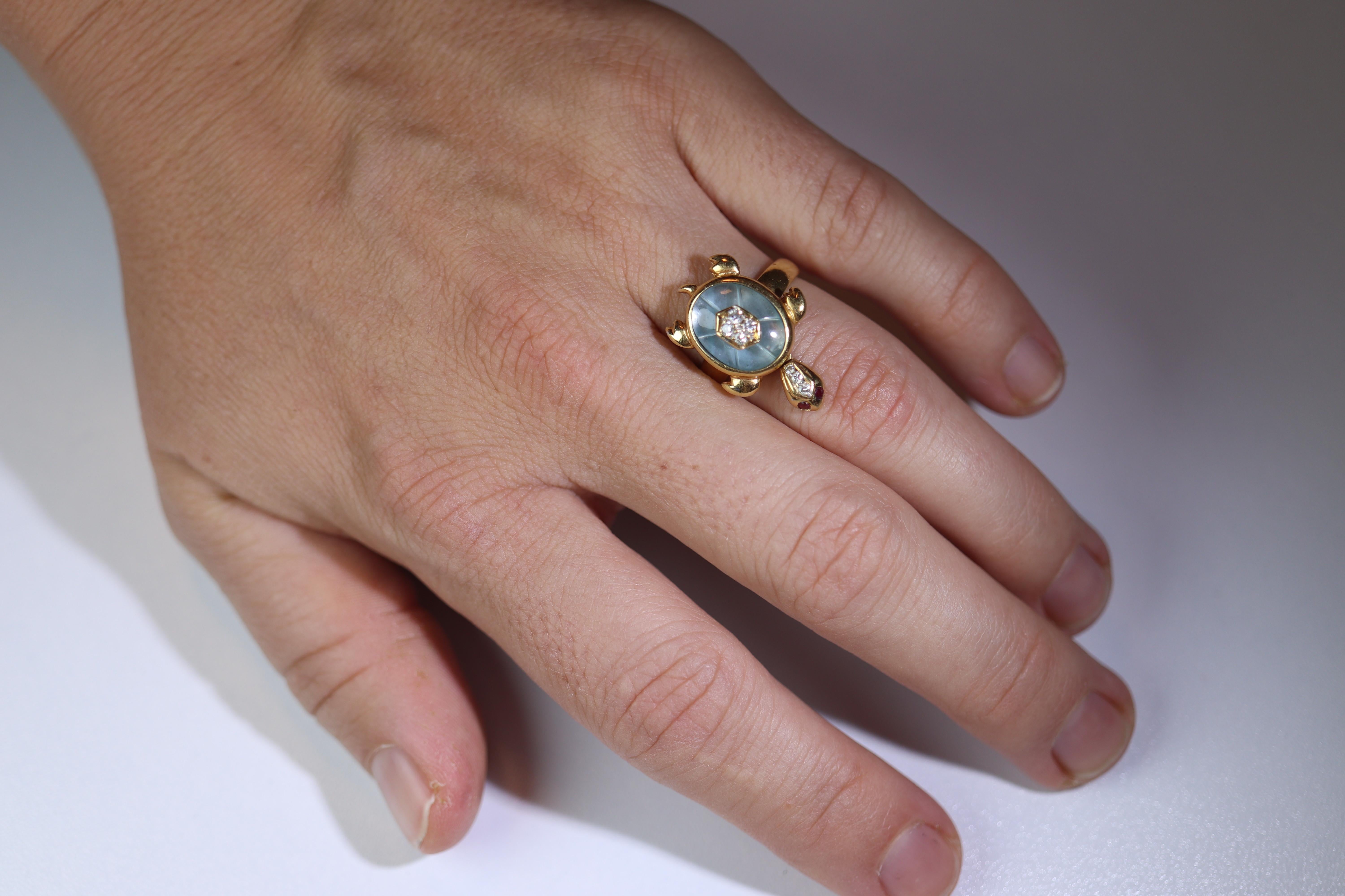 Adorable and Cute Turtle Ring.

3D made with Animated Head

18k Yellow gold with Carved Topaz shell, encrusted diamonds, and ruby eyes.

Light Blue Topaz 10mm by 14mm oval

Extremely rare.

Appraised independently at $3225

Details:
Size 5.75 ( can