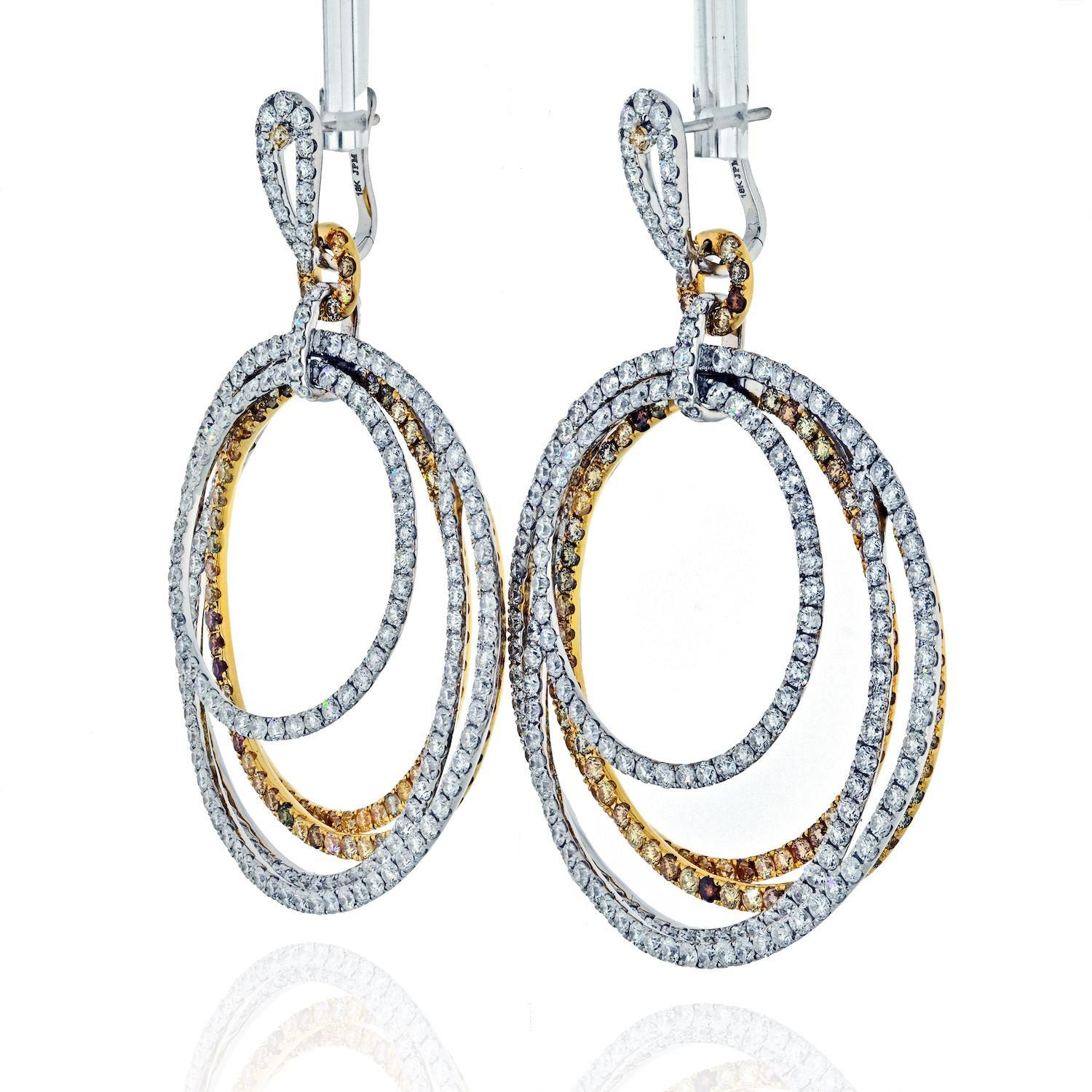 Brilliant pave round cut diamond earrings crafted in 18K two tone gold set with over 20 carats of diamonds. About 2 inches from top to bottom. 
For pierced ears. 2.25 inches long. About 1.25 inches wide.