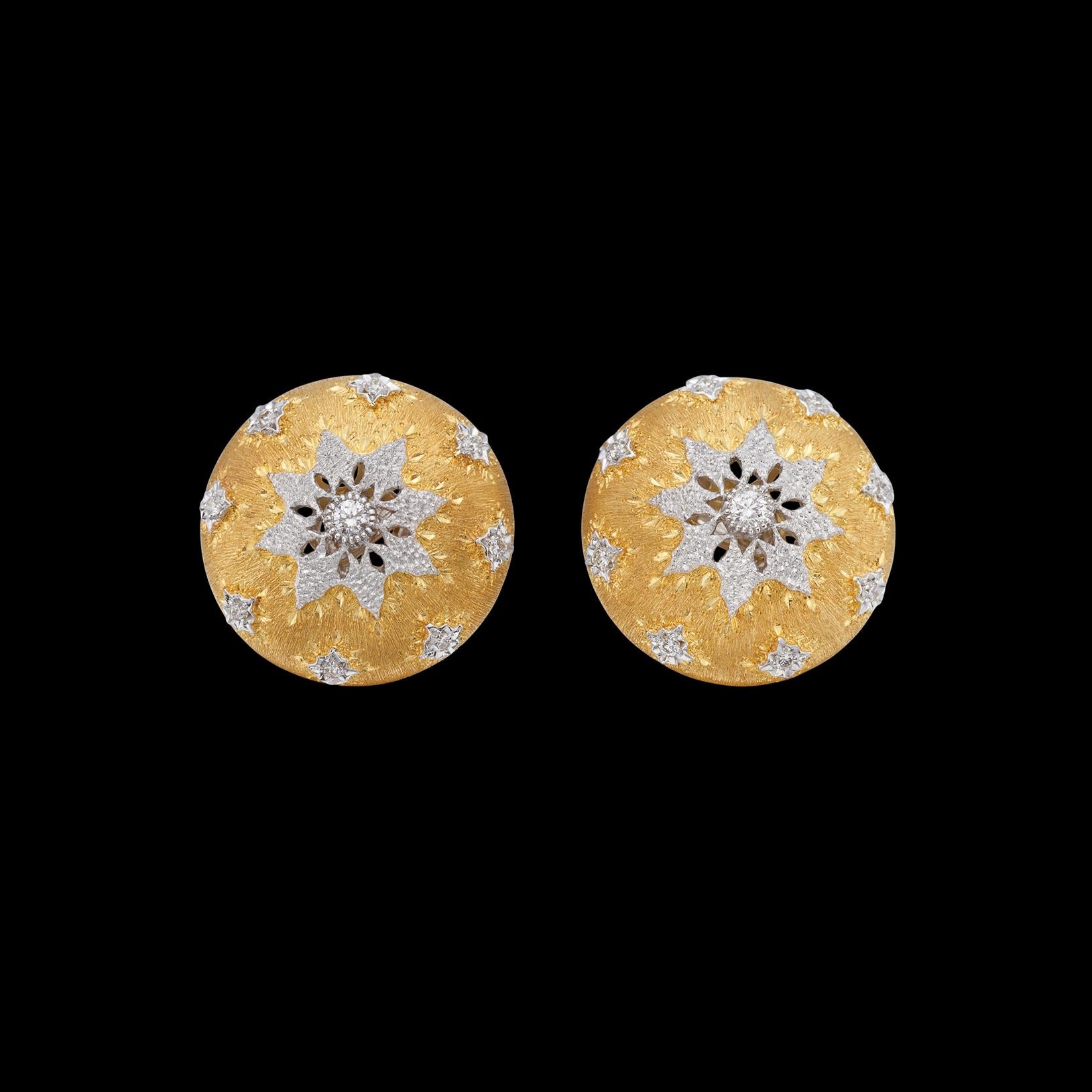Lacy and bold, these earrings evoke the finest of Italian craftsmanship. The 18k yellow gold large textured buttons, with white gold accents set with 18 round brilliant-cut diamonds, weighing approximately 0.50 carat. The earrings weigh 17.3 grams