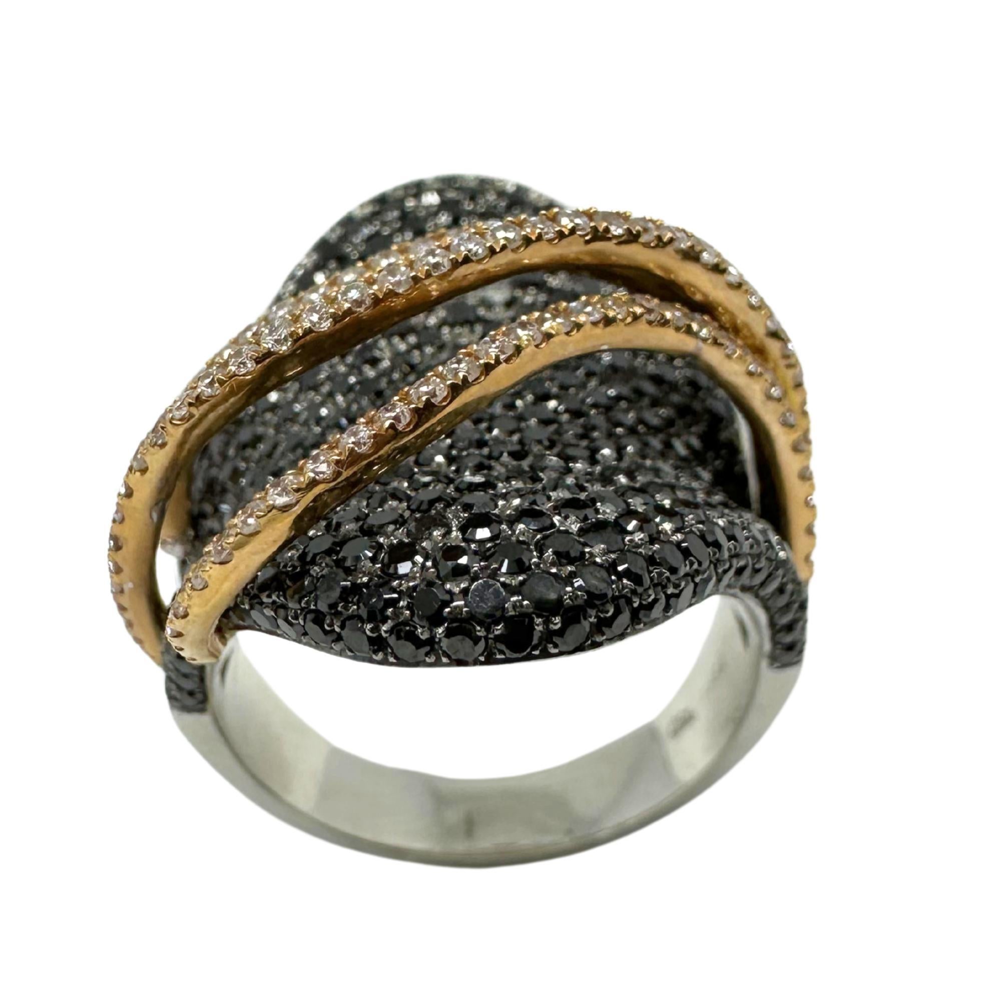 18K Two Tone Black and White Diamond Abstract Ring 
Condition: In good condition with some minor surface wear consistent with age.
Ring size: 7.25
Markings: 