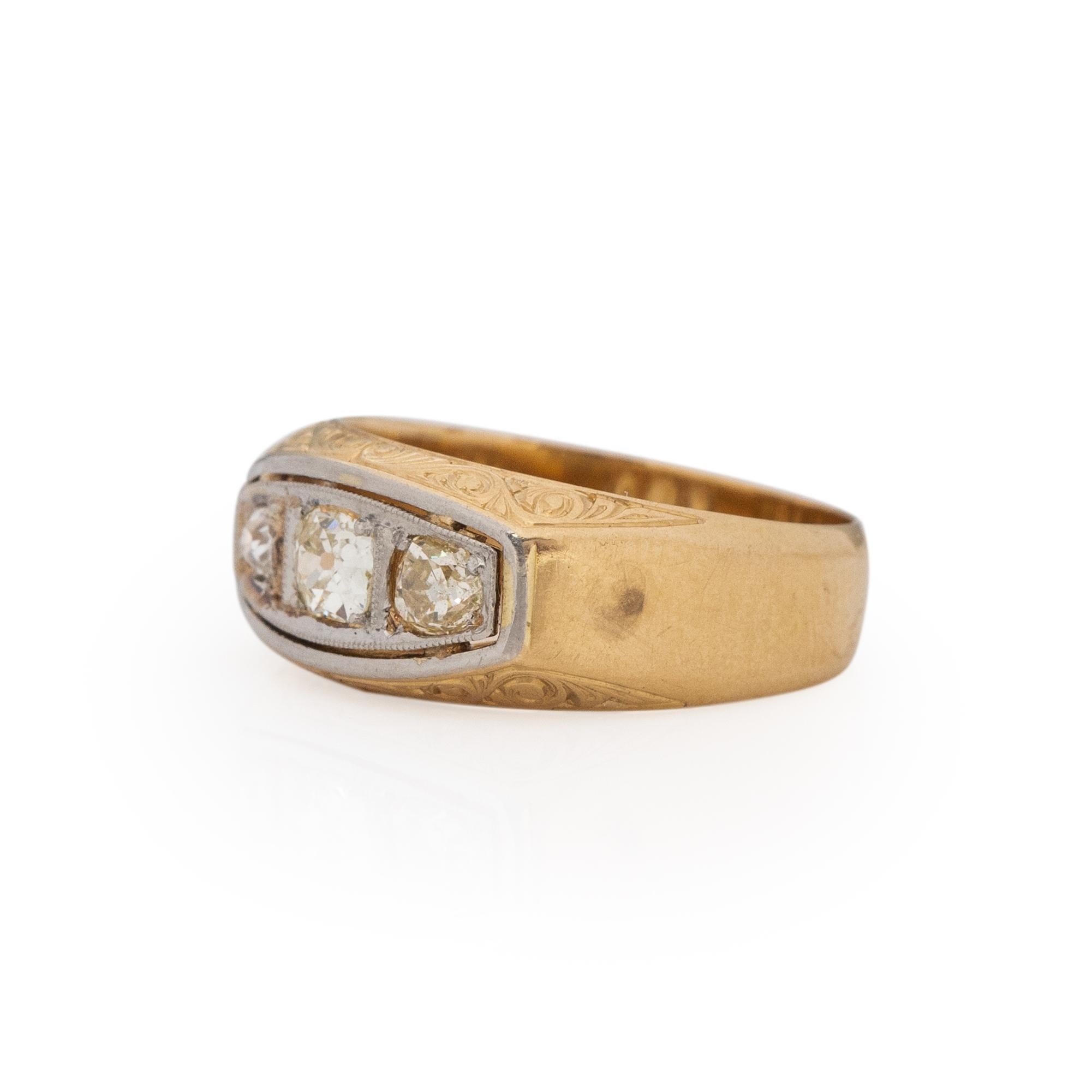 Here is something that we do not see all that often. A beautifully detailed unisex ring perfect for men or woman. Crafted in 18K white and yellow gold the simple wide band style of the shanks lead us to the white gold channel. Along the front and