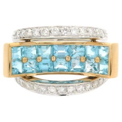 Anello geometrico moderno concavo in oro 18k bicolore con 2,48 carati di topazio blu e diamanti