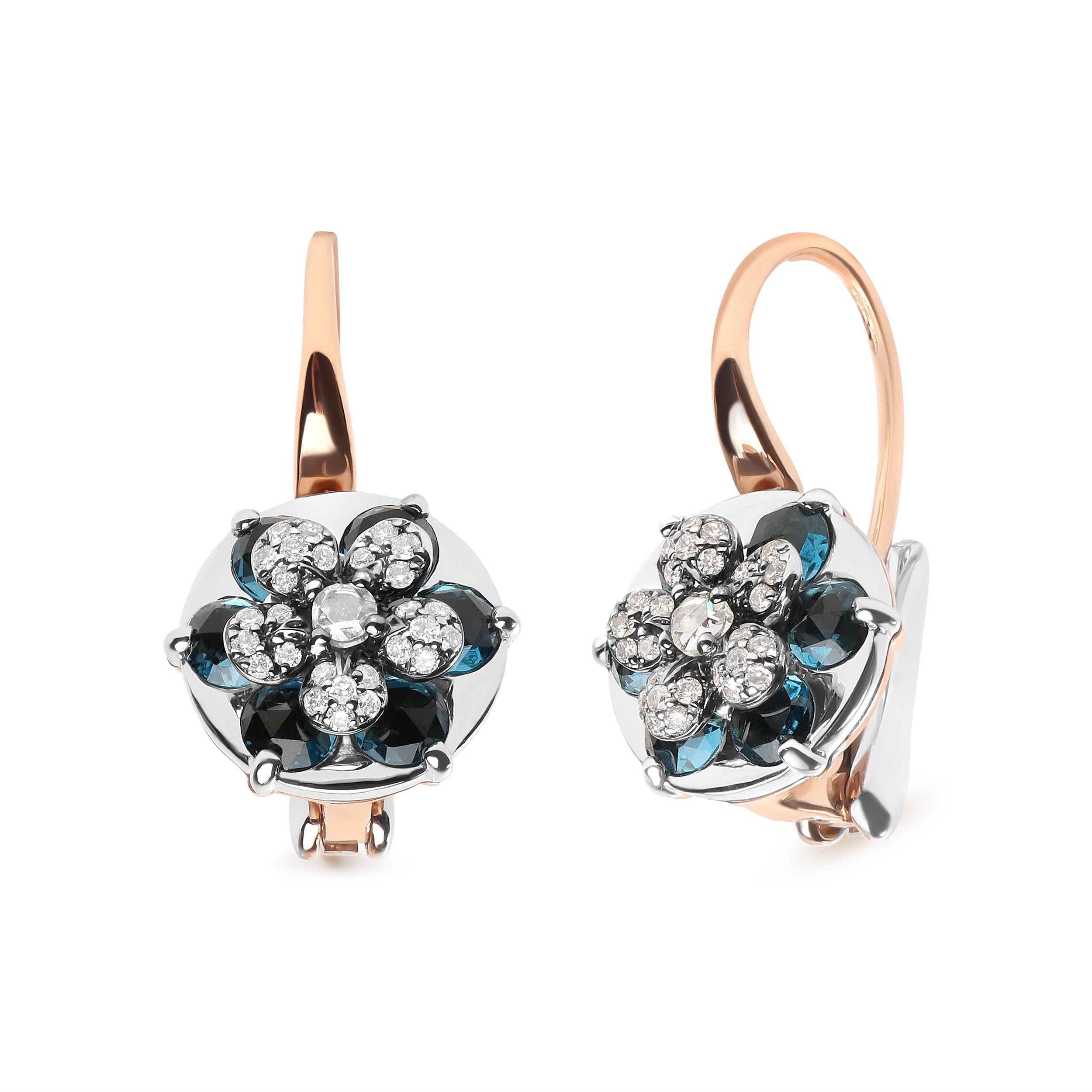 The decadent color of these 18k white and rose gold drop hoop earrings is mesmerizing! Natural 2.6mm round heat-treated London blue topaz gemstones radiate their warmth from prong settings in the form of petals to complement the flower motif of the