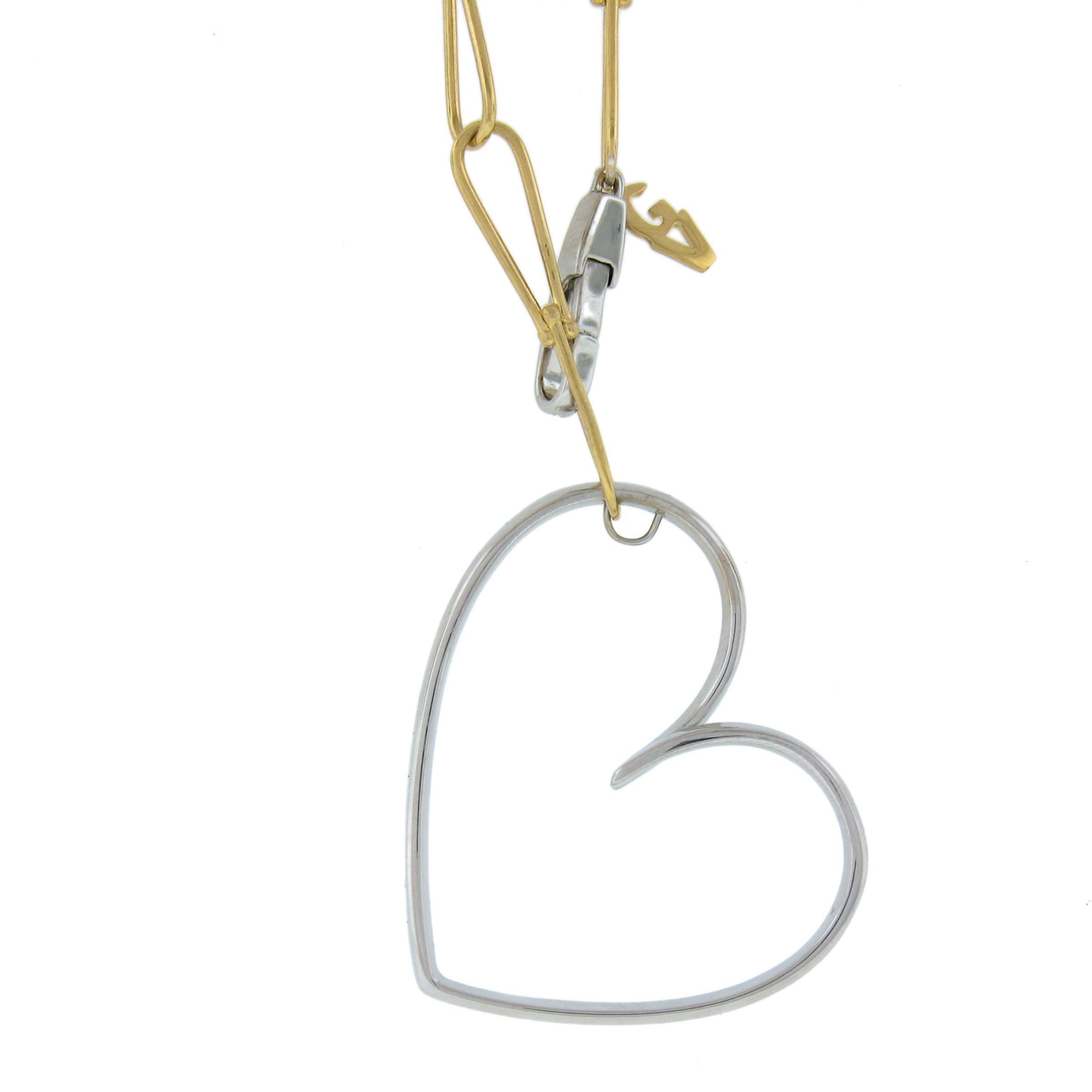 This gorgeous and very unique lariat necklace by Giorgio Visconti is crafted in Italy from solid 18k yellow gold with a large white gold diamond heart and clasp. This chain features fine and wide open infinity link design that allows the wearer to