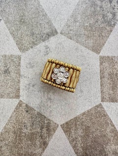 Anello elastico floreale Jarretière in oro bicolore 18K