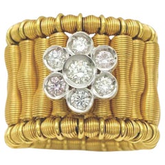 Anello elastico floreale Jarretière in oro bicolore 18K