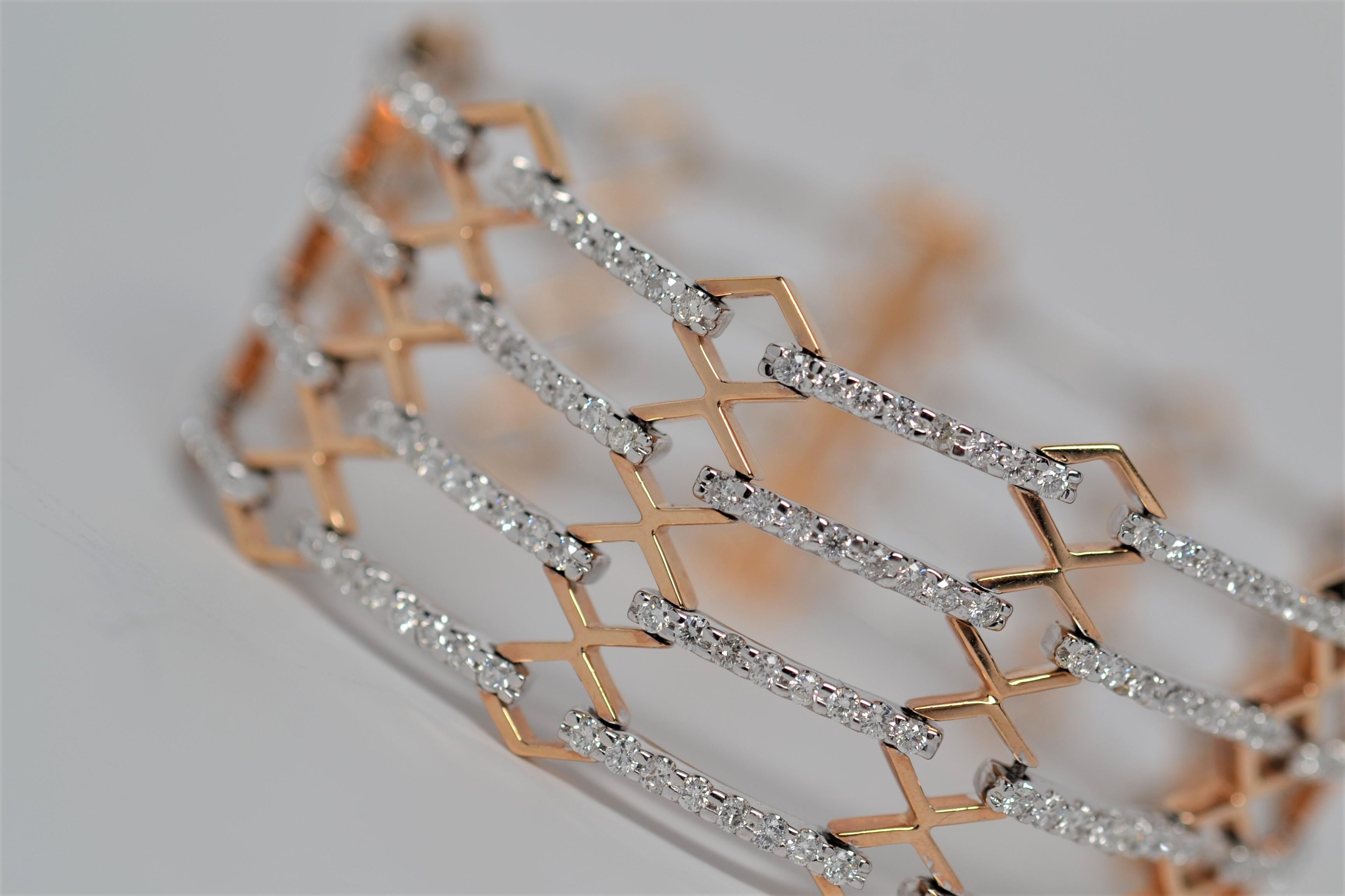 This finely made bracelet is a multi-row layout set in 18K White and Rose Gold. A total of three hundred and fifty two Round Brilliant Cut Diamonds weighing 4.03ct are set in single row strands using shared prongs. The diamonds are color grade range