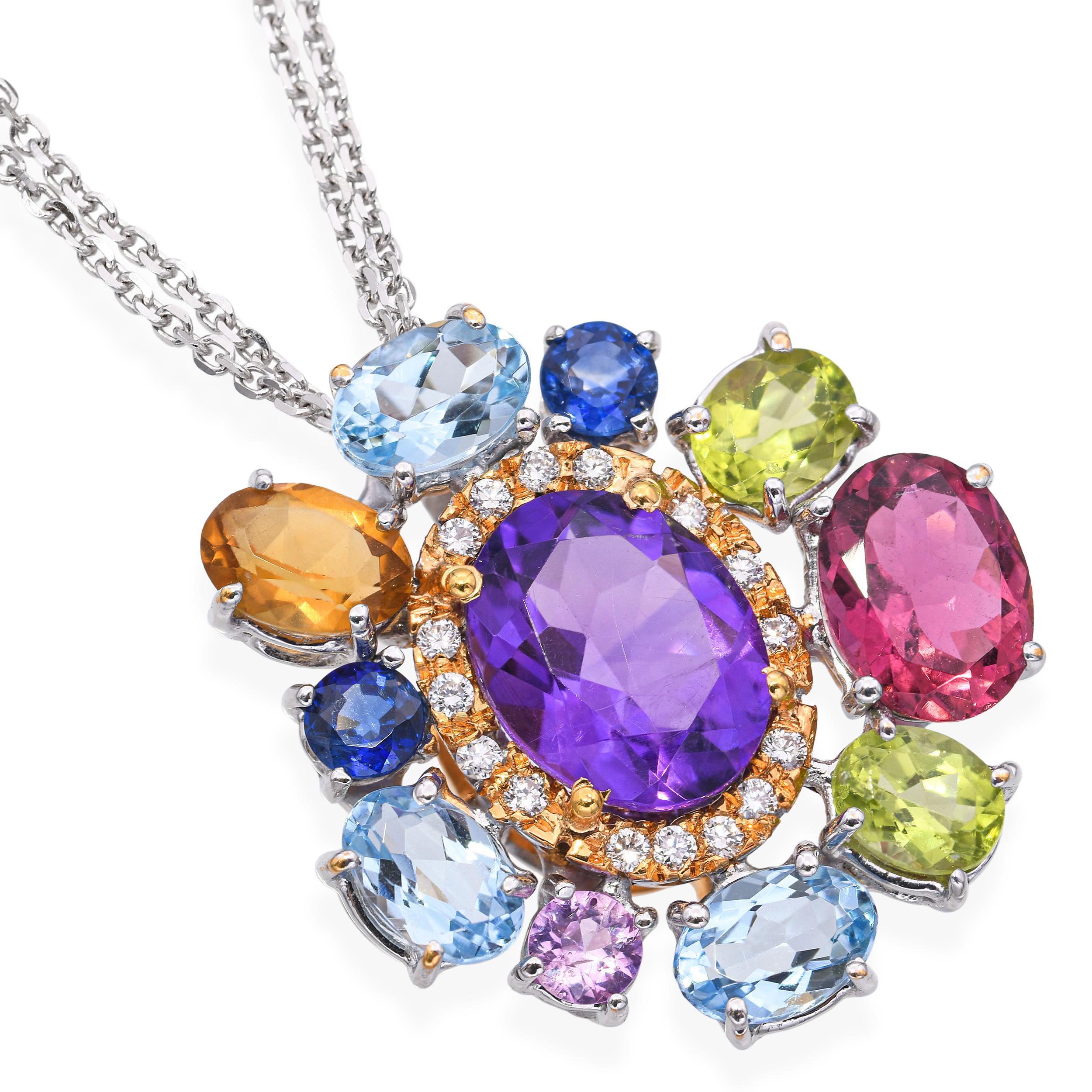 Collana con ciondolo in oro 18 carati e diamanti, con una vibrante composizione di gemme colorate e diamanti scintillanti. Il ciondolo è realizzato in un mix di oro giallo e bianco che offre contrasto ed eleganza, esaltando la brillantezza delle