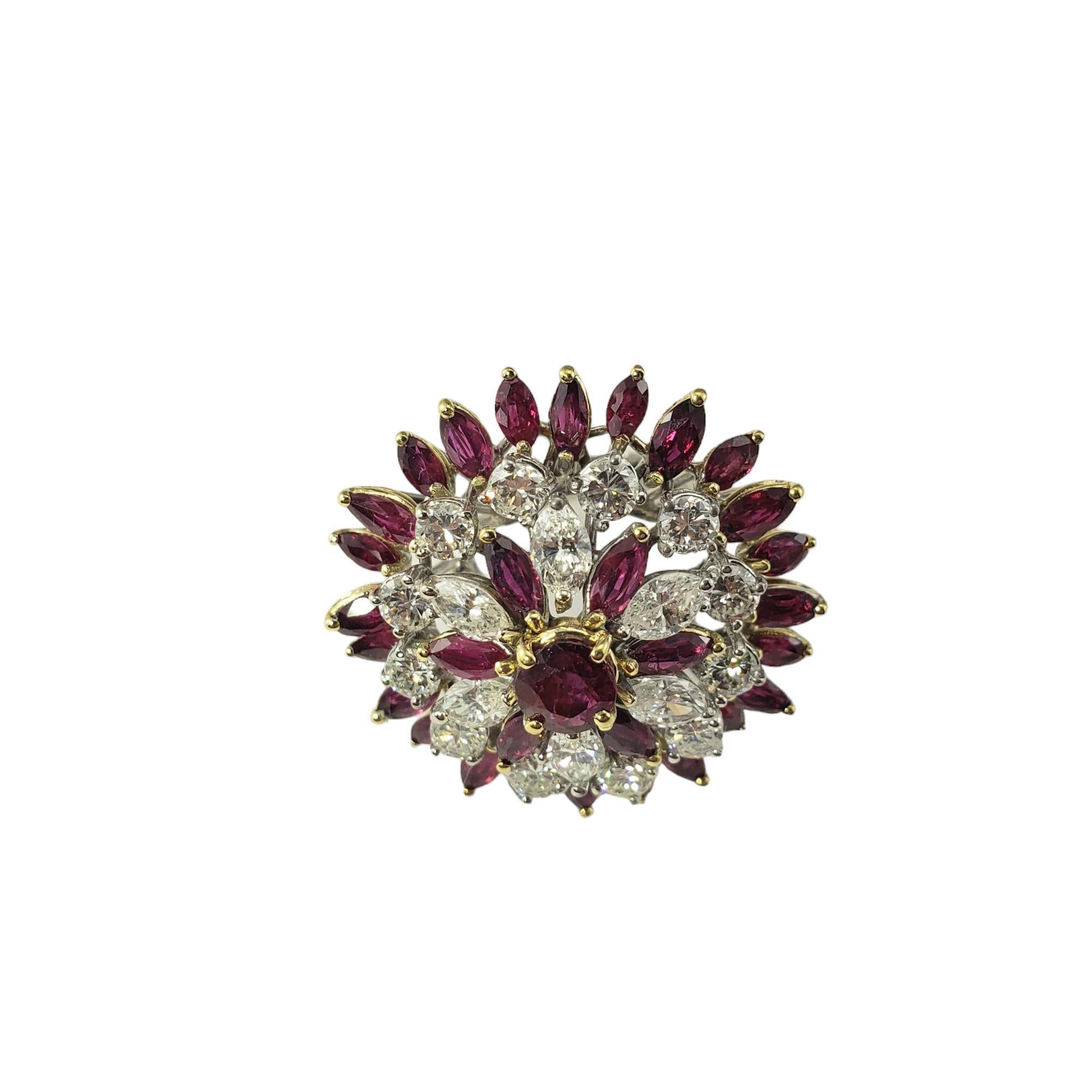 18K Two Tone Gold Ruby and Diamond Ring Size 6 JAGi Certified-

This spectacular ring features one round natural ruby, 30 marquise cut natural rubies and 18 marquise and round brilliant cut diamonds set in 18K white and yellow gold. 

 Width: 31 mm.
