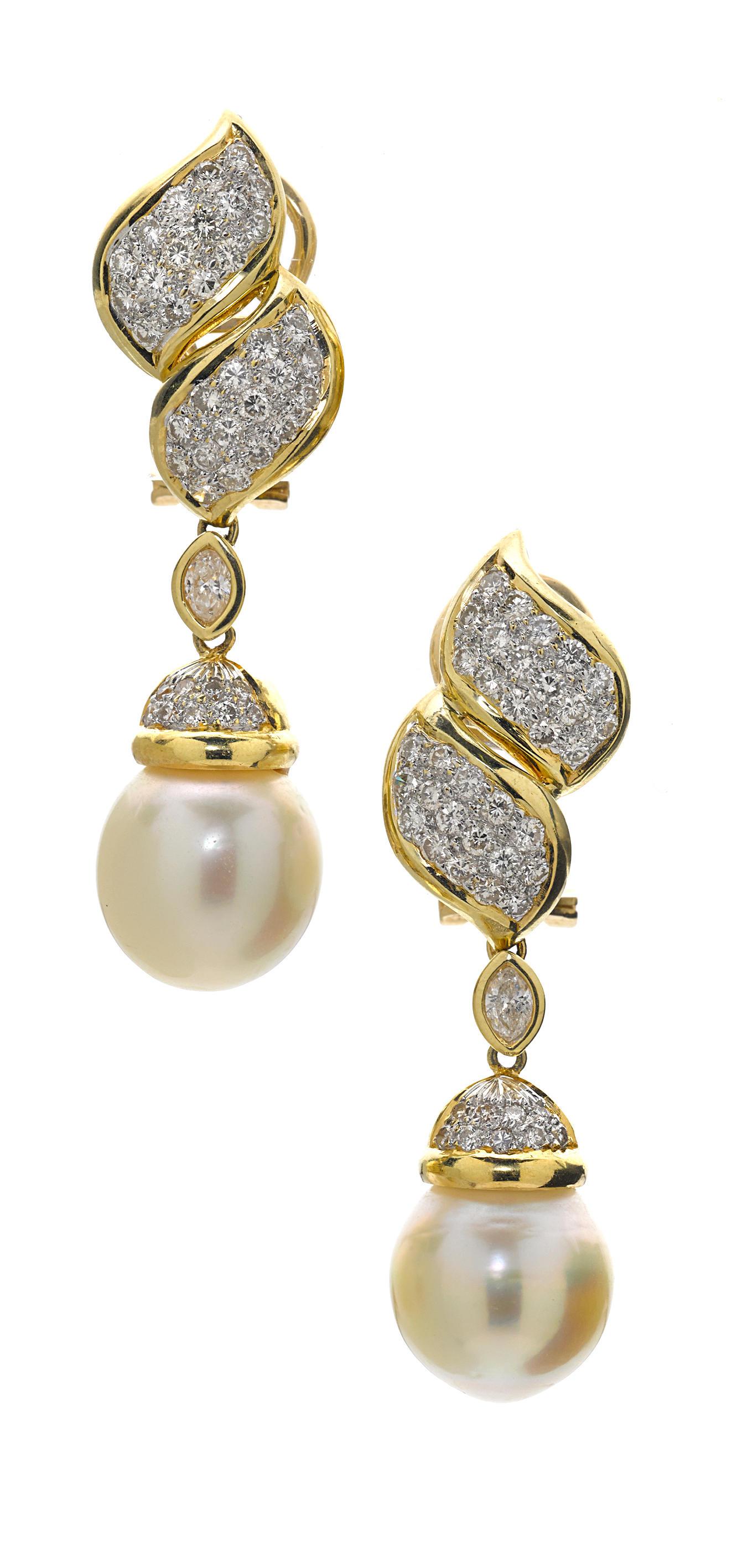 Features a South Sea Cultured Pearl measuring 12.5 x 12.5 x 12.5mm
Accented with Diamonds weighing 2.25 carats
Set in 18k Bi-Color Gold
Gross Weight: 19.1 grams
Length: 1-7/8 inches
Featured in Bonhams Auction #137 California Jewels March 30, 2015