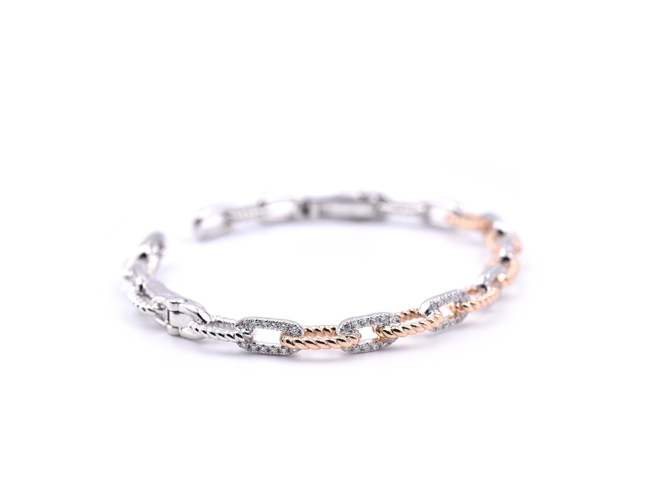 Designer: custom designed
Material: 18K Two Tone Rose and White Gold
Diamonds: 72 round brilliant cuts = .62cttw
Color: G
Clarity: VS
Dimensions: bracelet will fit a 6 ½-inch wrist and it is 6.65mm wide
Weight: 18.30 grams
