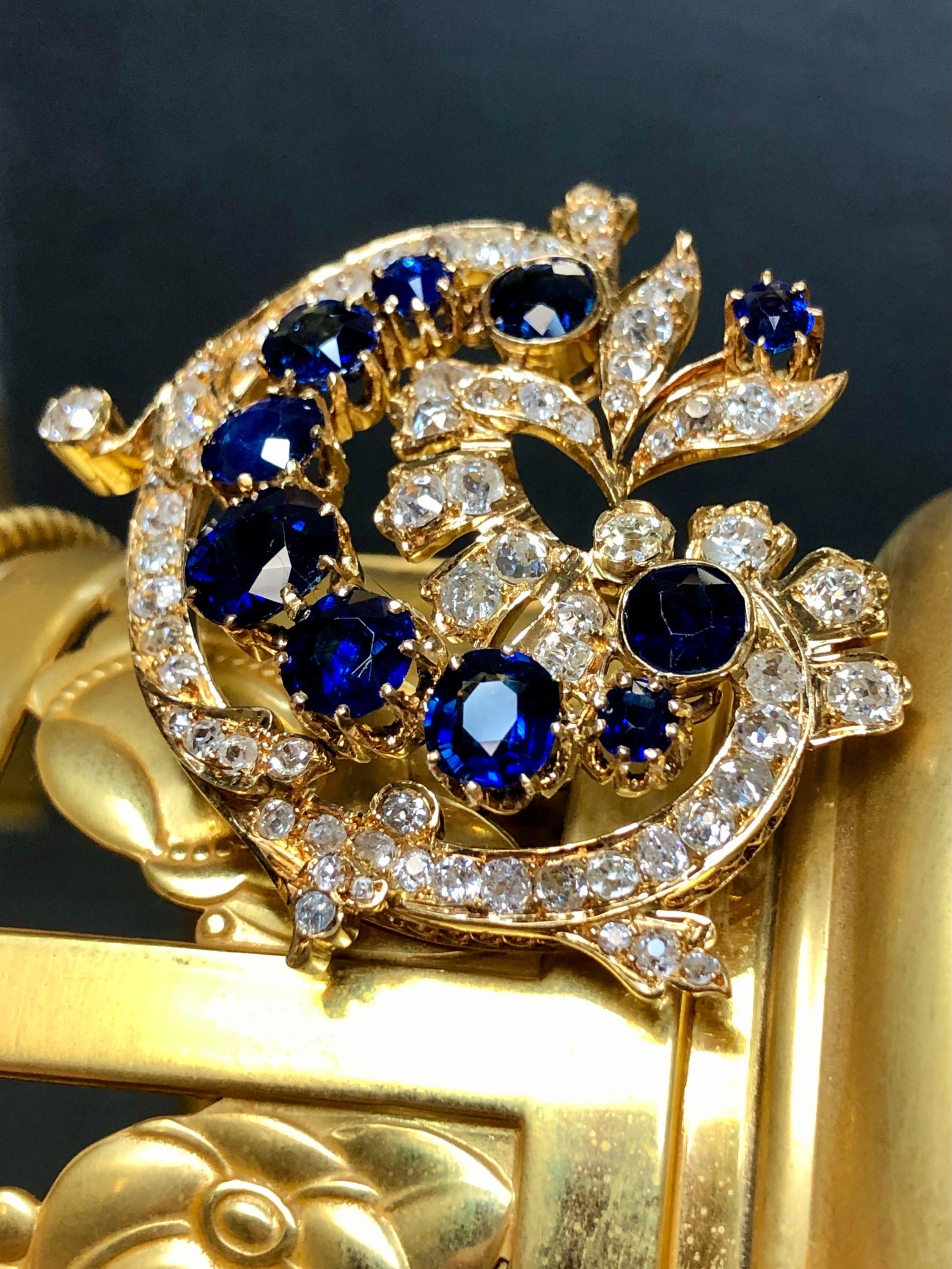 An exquisite example of true antiquity, this original Victorian era brooch has been done in 18K yellow gold (which is extremely unusual for the period) and set with approximately 5cttw in original old mine cut diamonds and 8cttw in natural NO HEAT