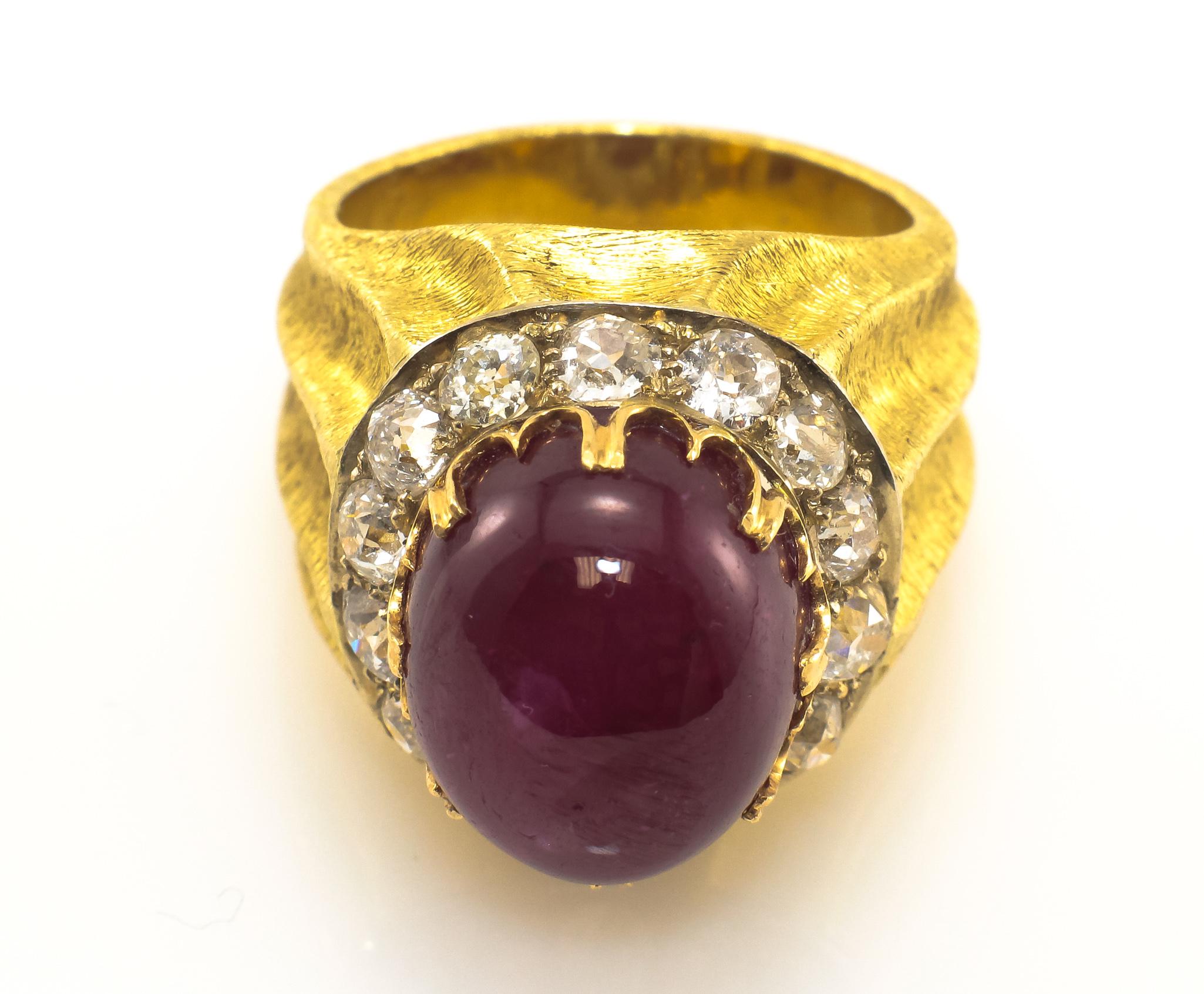 Vintage Mario Buccellati Ruby and Diamond Ring in 18K Yellow Gold.  The Cabochon Ruby weighs approximately 25.0 Carat and is surrounded by Old Mine Cut Diamonds 2.10 Carat Total weight, G-K in color and VS-SI in clarity.  Ring measures 1 1/4 inch in