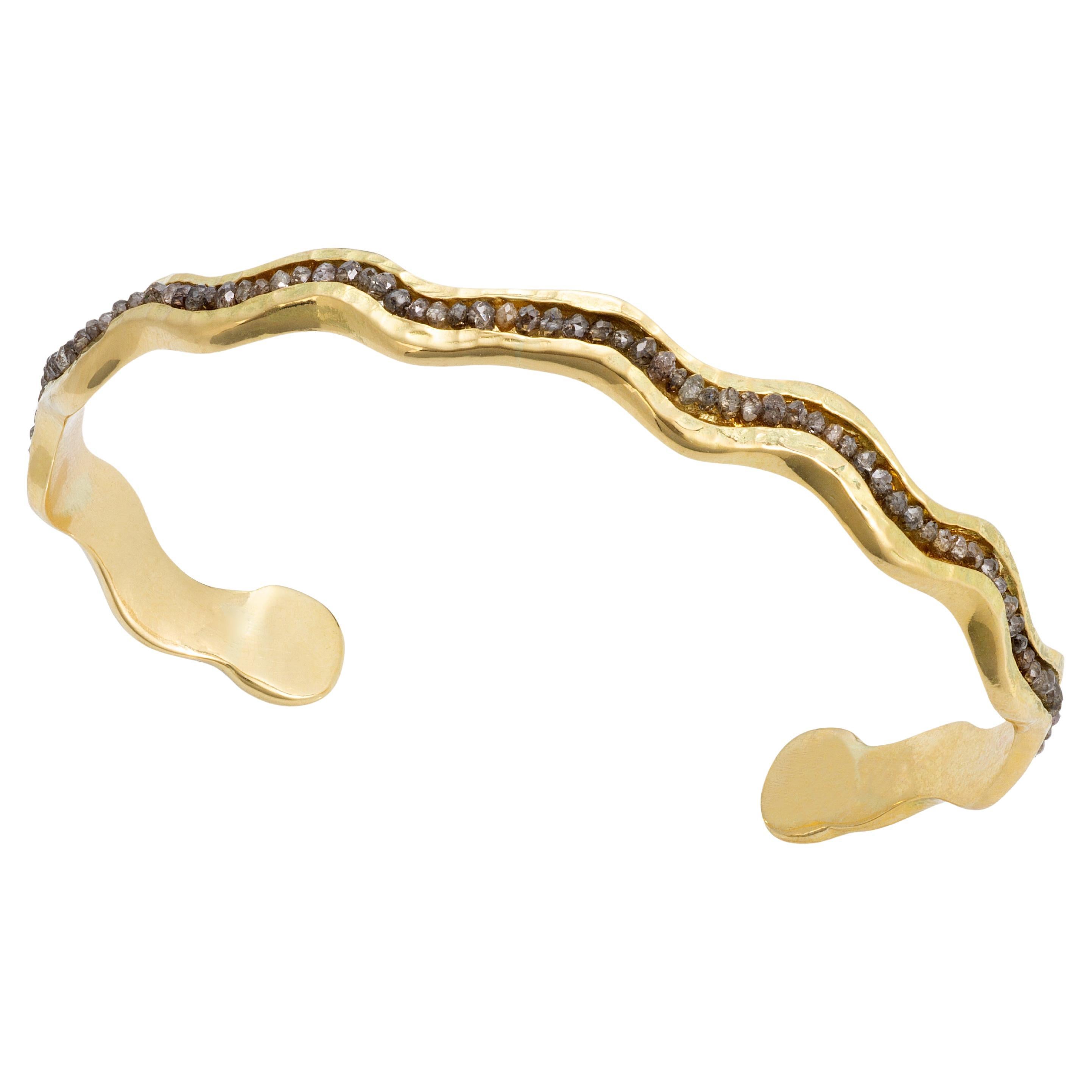 18K Yellow gold undulating Wave cuff with Brown faceted cut Diamonds is part of my Wave collection of cuffs and rings. The warmth of the rich yellow 18K gold pairs well with the mink colored brown diamond beads, all hand set. 