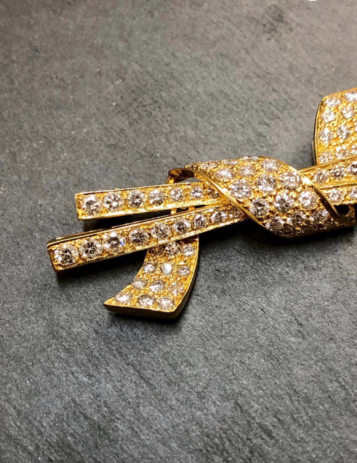 A beautifully made brooch done in 18K and set with approximately 3.40cttw in F-G color and Vs1 clarity round diamonds. Down to the azuring in the back, no expense was spared in the production of this wonderful piece.

Dimensions/Weight
2 1/4” long