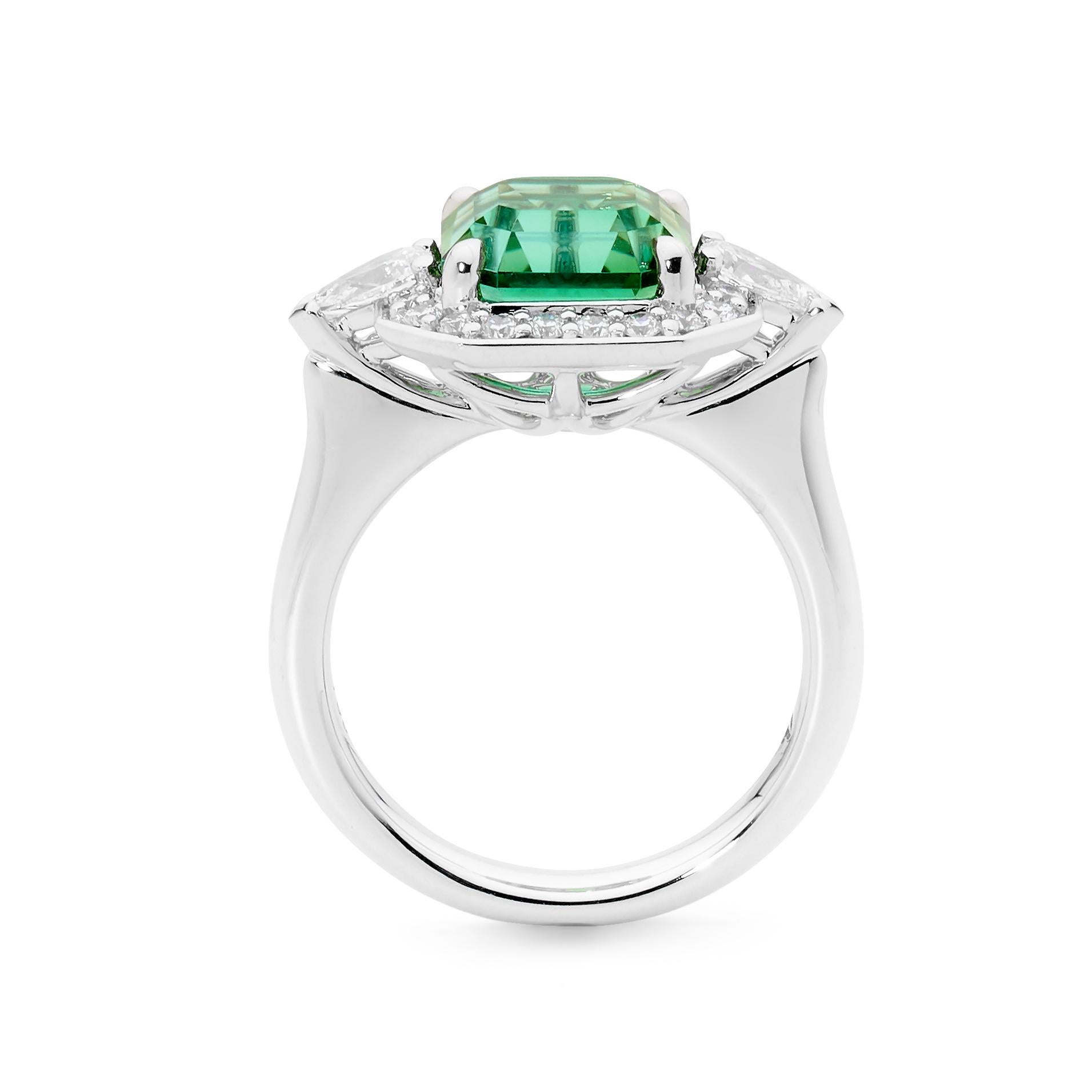 One stunning 18k White Gold Mint Tourmaline and Diamond Dress Ring.
Fingersize- 6 1/4 US Sizing. Able to be resized.
Stunning Mint Tourmaline - 4.27ct
Total Diamond weight - 0.70ct made up of pear shape and round diamonds.
Videos on request

One of