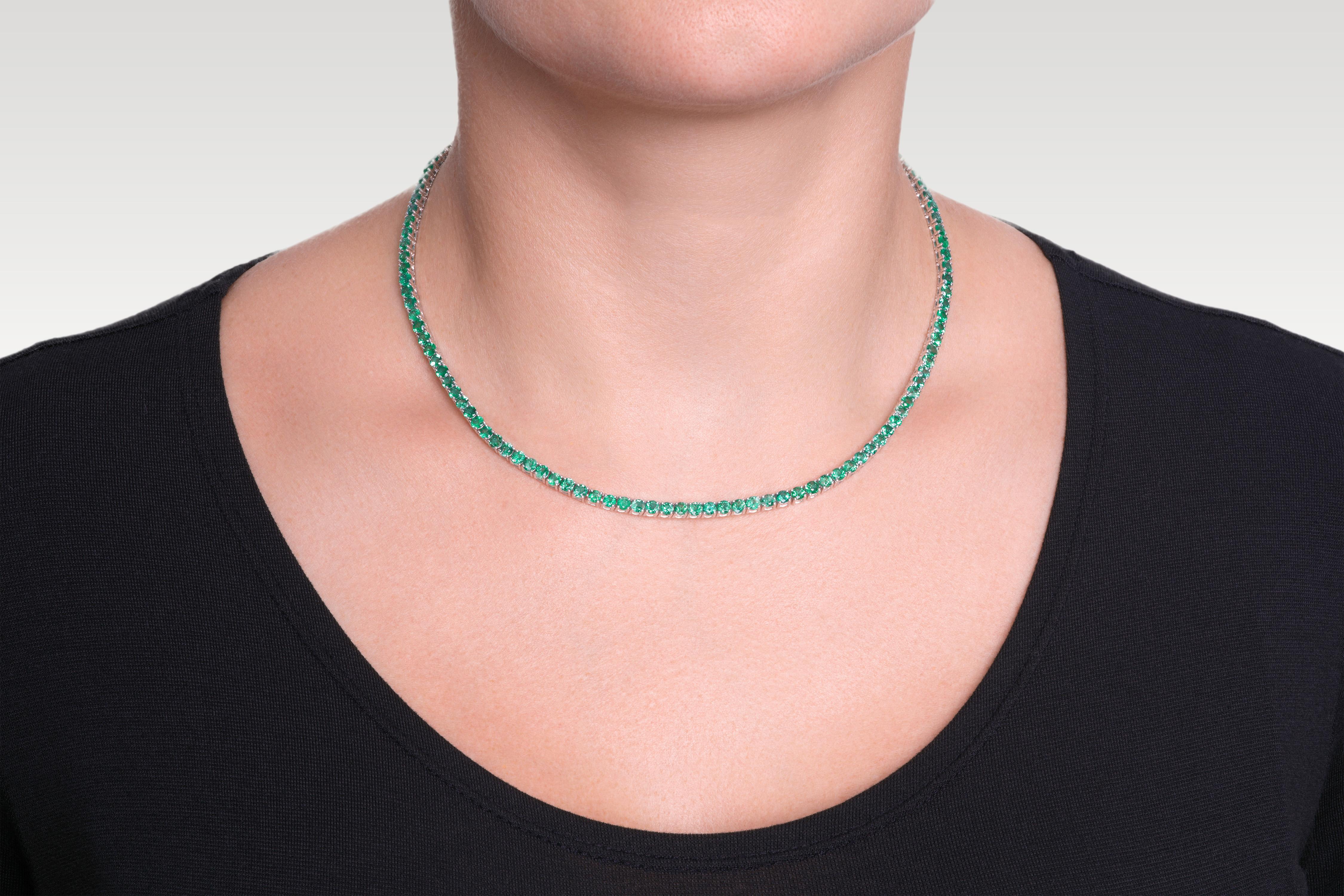 Handmade 18K White Gold Tennis Necklace set with 123 Round Brilliant Cut  Natural Green Emeralds weighting a total of 12.22carat, 16 inches. 