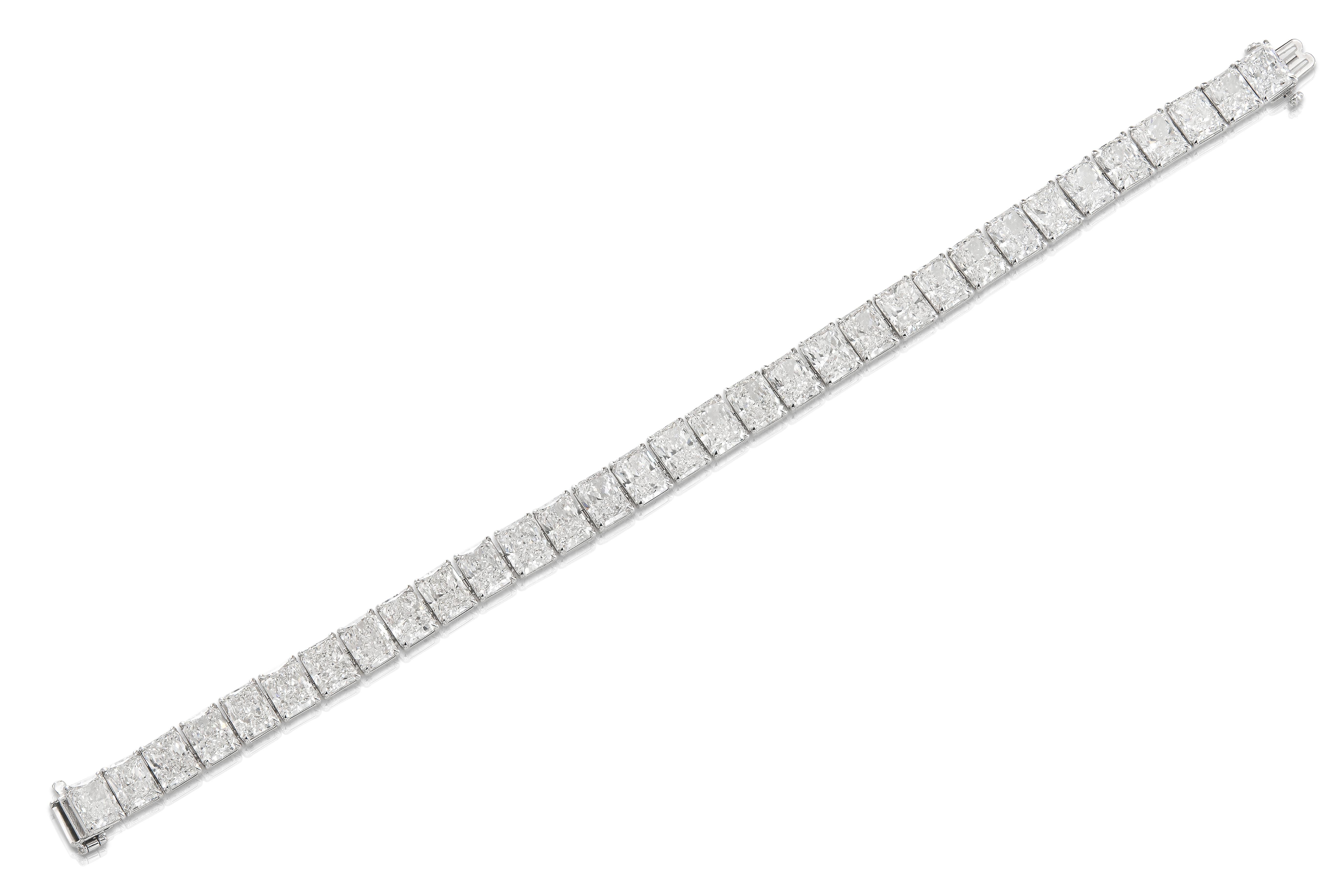 Modern 18K WG Radiant Cut Diamond Tennis Bracelet Tw: 32.20 carats For Sale
