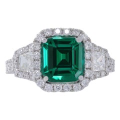 18k Wg Ring Diamond with 0.59ct Trp Diamond and Emerald 2.15ct