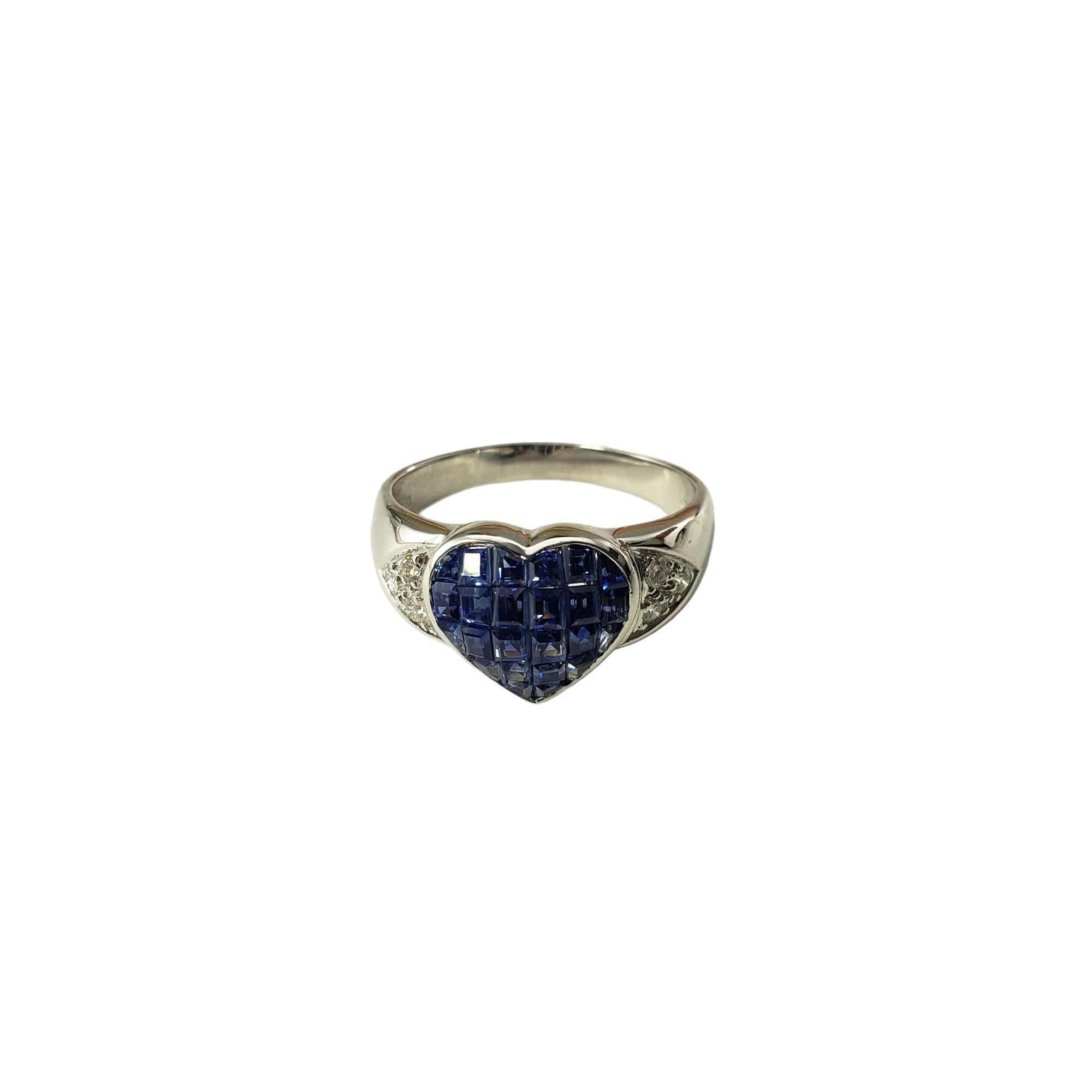 Vintage 18 Karat White Gold Sapphire and Diamond Heart Ring Size 9 JAGi Certified-

This elegant heart ring features 24 princess cut sapphires and six round brilliant cut diamonds set in classic 18K white gold.  Width:  11.4 mm.  Shank: 2.8