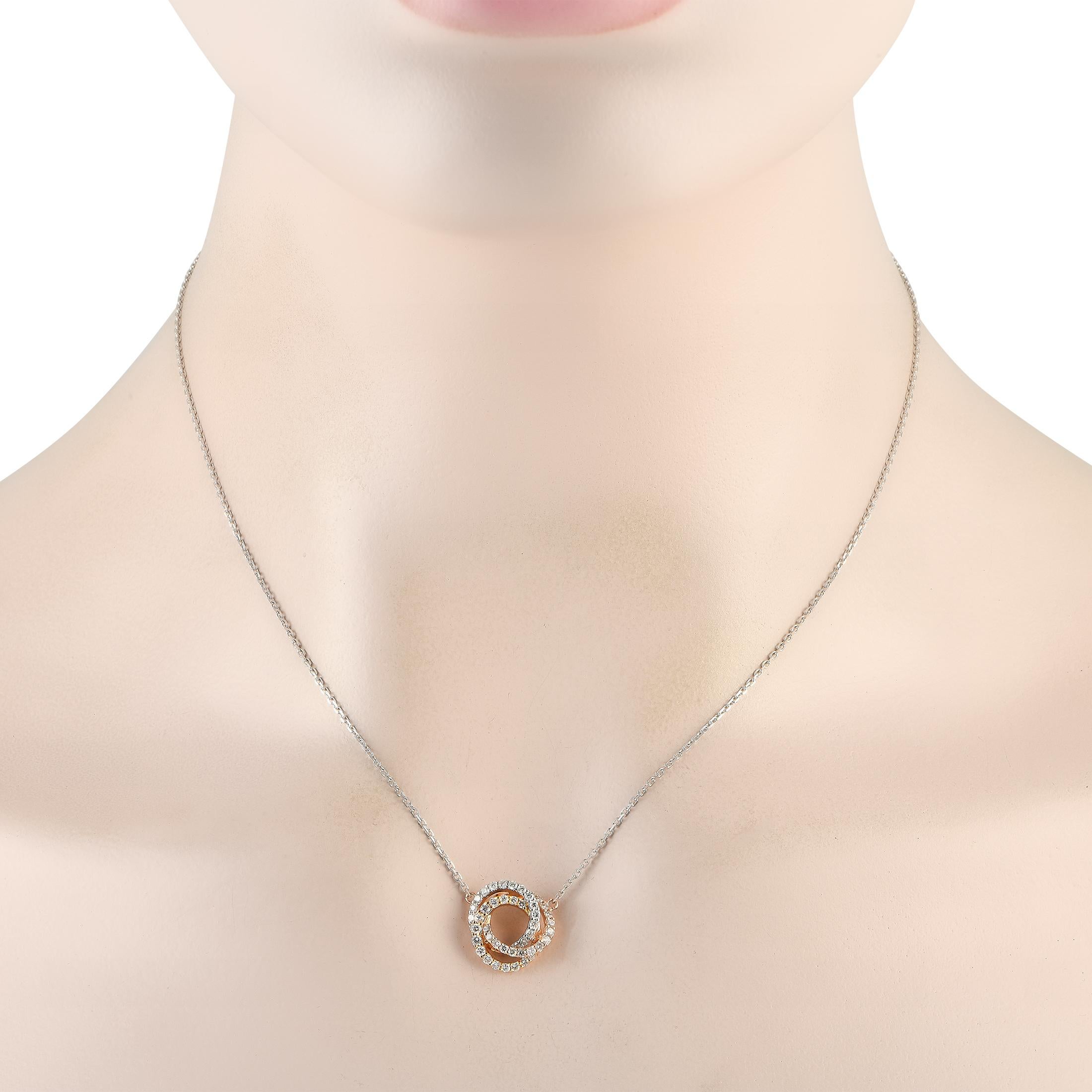 An instant stand-out, this necklace can add a sophisticated flair to your wardrobe. It is made from 18K white and rose gold and has three interlocking rings for its pendant. Each ring is outlined with round diamonds for a captivating sparkle.Offered