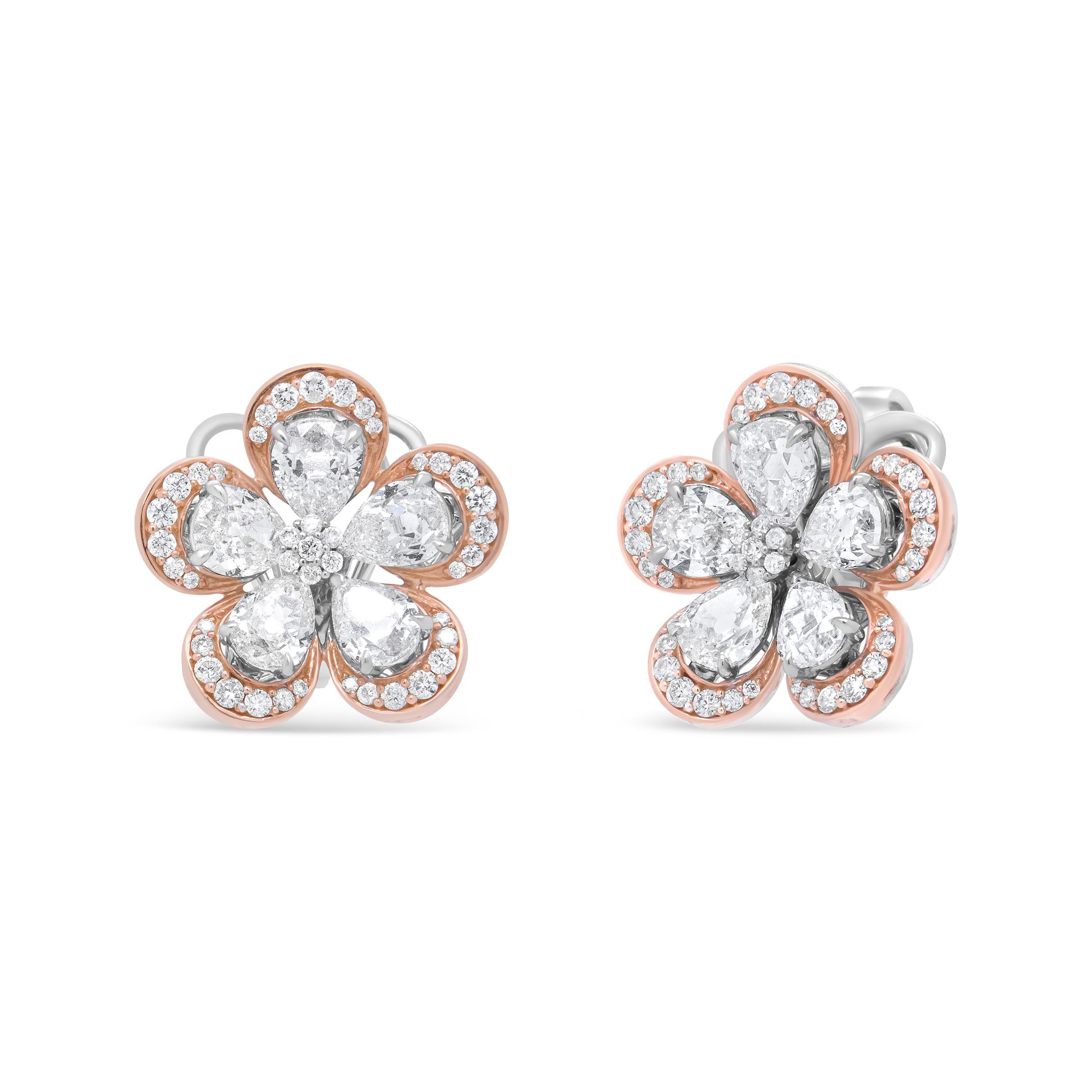 Depicting the elegance of a flower in bloom , this sophisticated pair of diamond studs radiated femininity and grace with a total 6.00 Cttw with an approximate G-H Color and VS2-SI1 Clarity. Five pear-cut diamonds serve as the petals of the blossom,