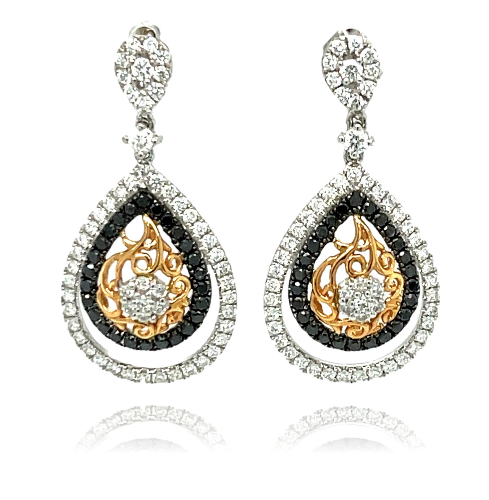 These stunning Drop and Dangle Diamond earrings have over 1 carat of sparkling diamonds all set in 18K white and rose gold. They have double lock closure for extra security. These earrings come in a beautiful box ready for the perfect gift! 

18Kt
