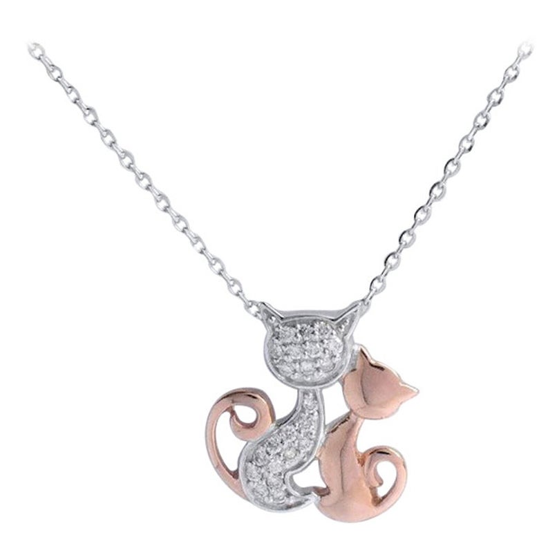 Collier à breloques en or blanc et rose 18 carats avec chat en diamant.

Délicat collier minimal en or massif 18 carats. Diamant naturel véritable de taille ronde : chaque diamant est sélectionné à la main par mes soins pour en garantir la qualité